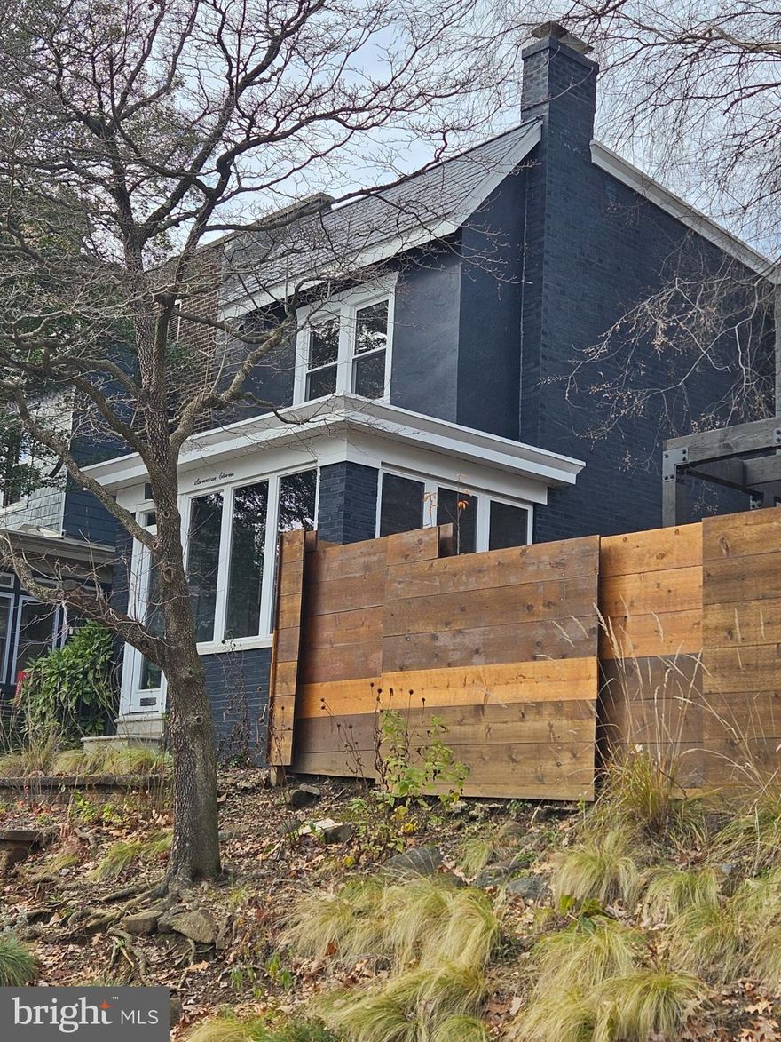 Nestled in the charming Trolley Square neighborhood, this beautifully renovated twin home offers a perfect blend of traditional elegance and modern convenience. Built in 1930 and revitalized in 2022, this residence draws you in with a beautifully painted brick exterior that exudes timeless appeal while providing a warm welcome to all who enter. Step inside the enclosed three season porch with slate flooring and through the double french doors to discover an inviting open floor plan that seamlessly connects the living and dining areas. The gourmet kitchen is a chef's dream, boasting top of the line finishes and appliances such as Quartz counter tops, a Z-line gas range and hood, a Kitchen Aide refrigerator, Stainless steel sink, a Grohe faucet and even a separate wine fridge to name a few! The spacious breakfast area is perfect for casual dining, while recessed lighting and double pane windows overlooking the terraced rear patio create a bright and airy atmosphere throughout. A cozy electric fireplace with heat and light settings add to the already warm glow of the home that naturally comes from the beautifully refinished hardwood floors.  With a total of 1,350 finished square feet, this residence provides ample space for relaxation and entertainment. The main floor is complete with a bathroom as well as a laundry room with a front loading Samsung washer and dryer adding to the convenience of daily living.  The full basement with both interior access and an outside entrance offers endless possibilities for customization-think home gym, workshop, or additional storage. The second floor is a treat unto itself with 3 comfortably sized bedrooms and 2 wonderfully renovated bathrooms featuring frameless glass shower enclosures, floating vanities, Pottery Barn mirrors/lighting and radiant heat flooring. Outside, the property's 2 level patio, full privacy fencing and a lovingly planted perennial garden create an inviting outdoor space for gatherings or quiet moments of reflection. The enclosed 3 season porch is a delightful spot to enjoy your morning coffee or unwind after a long day. Located in the vibrant Trolley Square area, this home is just steps away from an array of local amenities, including boutique shops, trendy cafes and the lovely Brandywine Park. The neighborhood is known for its walkability, making it easy to explore the rich culture and community events that define this area. With on-street parking available, you'll enjoy the convenience of city living without sacrificing comfort. This property is not just a house; it's a place to create lasting memories. Don't miss the opportunity to make this exquisite home your own in one of the most sought-after neighborhoods. Experience the perfect blend of historic charm and modern living-schedule your private tour today!