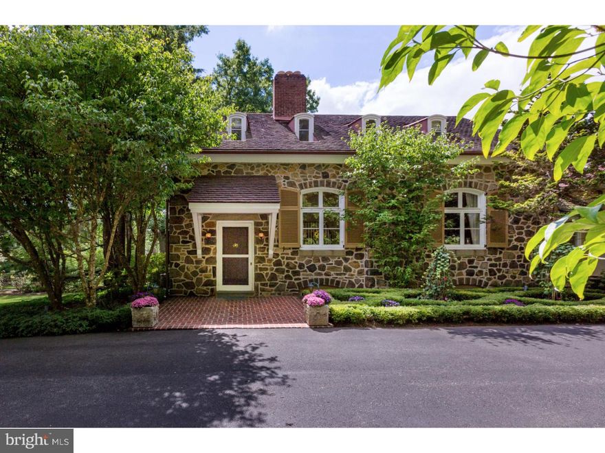 Understated elegance and historic charm define this lovely stone and stucco residence, situated on nearly two private acres, accessed through electronic gates, in an idyllic country estate setting with a "Ludowici" tile roof, mature landscaping, lovely gardens and in-ground pool.  Originally the 1886 Easttown School, this significant landmark was converted to a residence in 1930, marrying the enduring quality of yesteryear with modern convenience and style. Featuring 5 Bedrooms, 3 Full and 2 Half Baths, 10 ft+  ceilings, multiple French doors and fireplaces, a large updated "chef-worthy" Kitchen with top of the line appliances and granite counters, a Family Room with vaulted ceiling, gas-fired fireplace and abundant natural light, formal Living Room with gas-fired fireplace, formal Dining Room, a Library, a First Floor Master Suite, and finished lower level, this historic home has instant appeal. Part of the award-winning Tredyffrin-Easttown School District, this home is ideally situated near all Main Line amenities including shopping, public transportation, restaurants, parks, libraries, universities, and more.