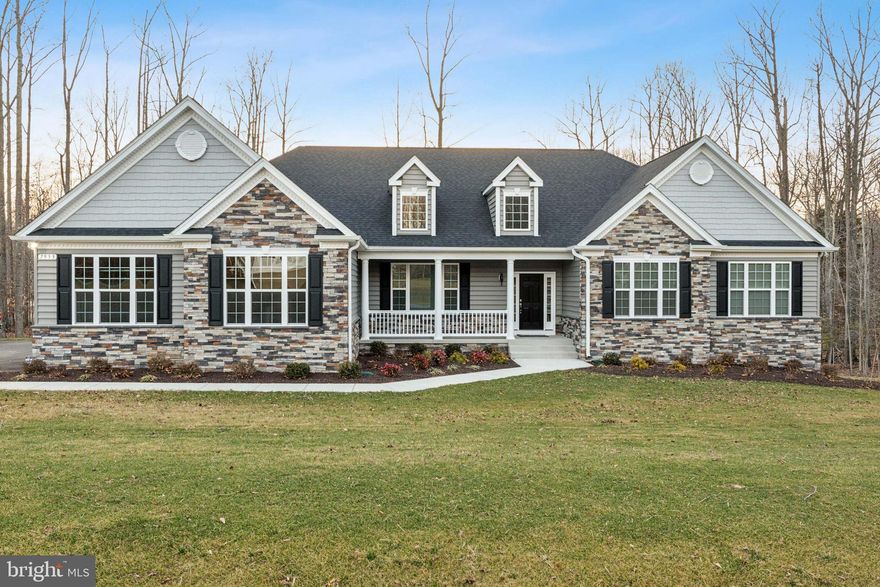 Why wait for new construction when this home was just completed in October of 2024. This gorgeous stone front Winchester model was built by Quality Built Homes.  This home features a 3-car side load garage, mudroom, cathedral ceiling in owner's bedroom with full bathroom, including the deluxe shower, separate vanities and soak in tub. Added rear extension for larger rooms, closets and pantry. Gas fireplace upgraded kitchen with Island and breakfast bar with kitchen table space and a formal dining room. The basement is unfinished for future plans and storage. Contact me today with any questions or to schedule a showing.