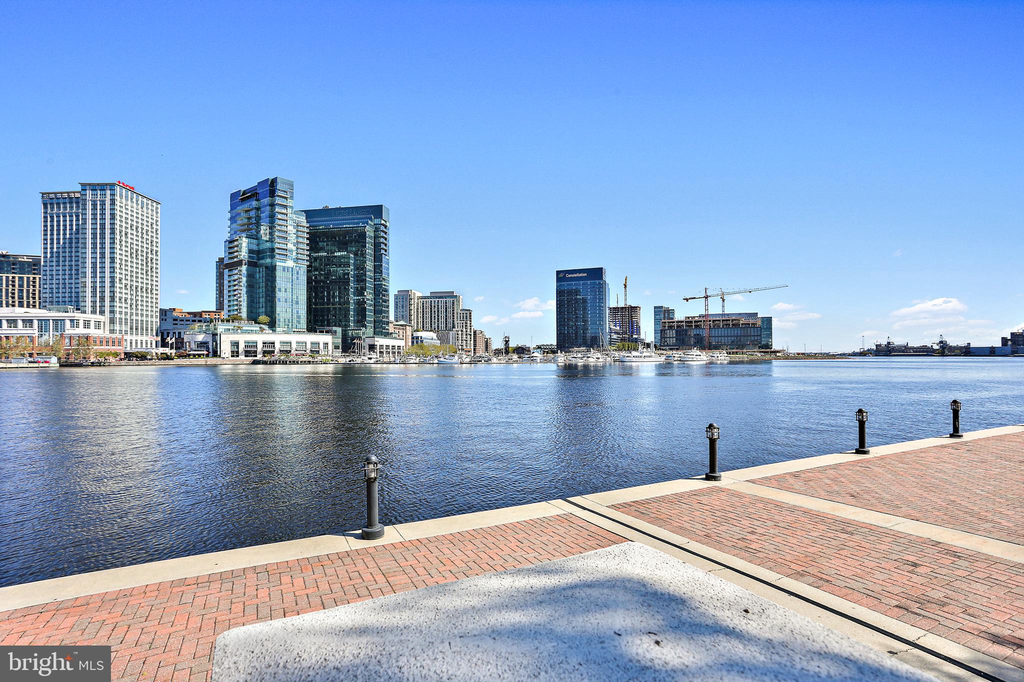 Remodeled. Refreshed. Reimagined. With FOUR spacious bedrooms and THREE AND A HALF bathrooms, this home boasts the finest in luxury living in Baltimore City at the Ritz Carlton Residences. This home offers over 4000 square feet of custom living space, state of the art features throughout and 5 STAR AMENITIES WITH OUTSTANDING STAFF to support you and your life. Interior features include hardwood floors throughout, custom fireplace, INCREDIBLE WATER VIEWS from every window, PRIVATE ELEVATOR TO THE RESIDENCE, tons of storage options and OPEN LIVING SPACE that is perfect for entertaining and everyday living. Looking to spend time outside? This home has TWO OUTDOOR BALCONIES to watch the boats in the Inner Harbor. Parking is never an issue with 2 DEEDED PARKING SPACES (one with an electric car charger) and 2 DEEDED VALET PARKING SPACES FOR GUESTS. The 24/7 concierge, valet, and security ensure your every need is met, while the indoor heated saltwater pool is ideal for relaxation. Maintain your wellness journey in the state of the art gym, invite family and friends to movie night in the theater, or host a soirée in the residents lounge or have game night in the game and billiards room. Need extra space for guests? No problem, luxurious guest suites are at your disposal. Experience the pinnacle of urban living in Baltimore City at this exclusive residence. This is the good life!