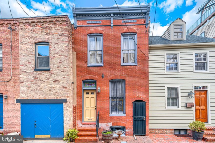 Fells Point rowhome • private rear patio • Carrier HVAC 2022 • water heater 2024 • bright rear addition • upstairs laundry • beautiful architectural character

705 S Regester St is a 2-bedroom, 1.5-bath Fells Point rowhome with updated systems, beautiful architectural character, upstairs laundry, and private outdoor patio space in a highly desirable location. Carefully updated during long-term ownership, the seller notes that, among the properties she owned in Fells Point over the years, this was the one she intended to keep for herself, which is reflected in the quality of the updates, attention to detail, and craftsmanship throughout. Interior features include hardwood tongue-and-groove flooring, Marmoleum flooring, dimmer switches throughout, ceiling fans in most rooms and hallway areas, and two solar tubes that bring in additional natural light. The front bedroom features a 10-foot ceiling. Refurbished original 1920 doors sourced from another home add character and architectural interest. Rear Marvin wood windows and doors, including the rear French doors, complement the home’s preserved original exterior bullnose window detail. The rear wall and separation wall have been finished with stucco and waterproof coating. Plumbing is copper throughout. Mechanical updates include a Carrier Comfort gas furnace and Carrier Comfort Series A/C installed in 2022, along with a water heater and main water-line pressure valve installed in 2024. The lower level is waterproofed and provides storage, with a French drain around the full basement floor, sump pump, and wide newer basement steps. Altogether, it is a home with warmth, character, and a level of care that is felt throughout.