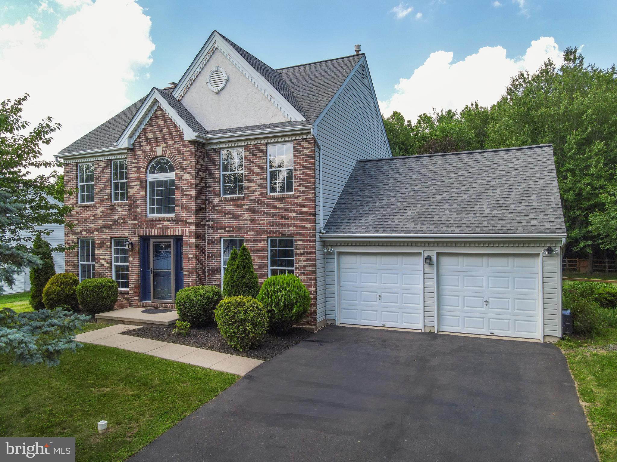 This “Barness-Built” 3-bedroom Aquetong Colonial features a significantly large sunroom addition in one of the most private lots in the subdivision! Is nestled in the highly sought-after Hearthstone community within the award-winning Central Bucks School District. The fenced back yard is open and is nestled between treed common space as well as open and wooded common space adjacent to one side of the property. The 2-story entry foyer features refinished hardwood flooring and stairs leading to the upper level. The freshly painted formal living includes new carpeting (6/25) and is a great place to entertain. The freshly painted formal dining room is also adjacent to the foyer and includes new carpeting and a new chandelier. The entire interior has been freshly painted (5/25) and new luxury tile vinyl flooring can be found in every room and the hallways on the main level of this most elegant home. Relax or entertain in the family room, which includes a wood-burning brick fireplace with a raised hearth and wood mantle and is open to the kitchen area. A glass slider leads to the sunroom addition (2010), which features a wall of windows with scenic open and wooded views, a tray ceiling, and a door that exits to the fenced backyard. The updated kitchen boasts newly installed Quartzite Counter Tops (5/25) with a large undermount stainless-steel sink and fixture, stainless steel appliances including a GE French door refrigerator with bottom freezer, a Samsung 5-burner gas stove/oven with center bridge, and a GE dishwasher. Also featured is a breakfast room with a bay window, a pantry and new lighting fixtures. The laundry room and half bathroom with new Quartzite countertops complete the main level of this most desirable home. A turned staircase with newly installed carpeting 6/25) leads to the upper level. (Newly installed carpeting can also be found in the upper hallway, want all bedrooms/closets) The main bedroom includes 2 spacious double closets and an owner’s bathroom featuring a newly installed quartzite counter-top, a soaking tub, and a walk-in shower. Two other nicely appointed bedrooms with spacious, extra-large double closets and a hall bathroom complete the upper level. The unfinished basement provides a copious amount of storage space or can be finished by the next homeowner. Other updates include a newer HVAC system, a newer roof and gutters and much more! Ideally situated within very close walking distance to Hansell Park—featuring walking and jogging trails, pavilions, playgrounds, and soccer fields—this home also offers convenient access to Bush and Holicong Parks. Just minutes from historic Doylestown Borough, residents can enjoy premier shopping, dining, museums, and entertainment. With easy commuting options to New York, New Jersey, and Philadelphia, and close proximity to the Doylestown SEPTA train station, this location combines charm, convenience, and lifestyle in one exceptional setting.