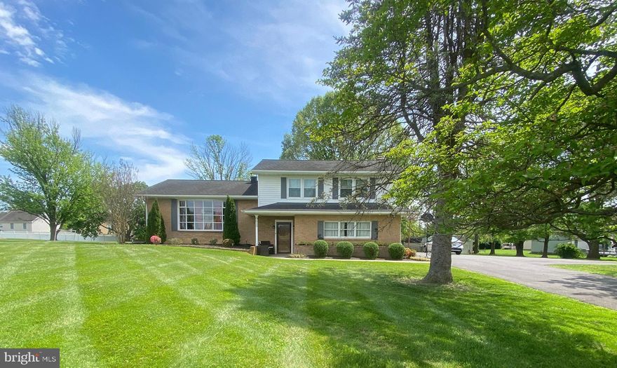 Multiple offers received. Offer deadline Tuesday, May 20th at 11am. Welcome to this beautiful 4-level split home located in the heart of Walkersville, nestled on nearly an acre of usable land with breathtaking mountain and pasture views. Offering over 2,000 square feet of finished living space, this spacious home seamlessly blends comfort, style, and function. Step inside to discover a bright and inviting main level featuring rich hardwood floors, a large bay window in the living room that fills the space with natural light, and an elegant dining room with access to the covered back porch—perfect for entertaining. The upgraded gourmet kitchen boasts modern finishes, stainless steel appliances, and plenty of cabinet space for the home chef. Upstairs, you’ll find a generously sized primary suite complete with a walk-in closet and private bath, along with two additional bedrooms and a full hall bath. The lower level offers a cozy family room with a wood-burning fireplace, a half bath, and a convenient laundry room. Head down one more level to a fully finished rec room that’s ideal for a game room, home gym, or media space—plus a large separate area perfect for storage or a home office. Outdoor enthusiasts will love the expansive, private backyard with mature apple and crabapple trees, space for a large garden, and even an old shed with an attached chicken coop. The covered back porch offers a peaceful retreat with serene views in every direction. Additional highlights include a detached garage, new wood flooring, recently paved driveway, new water heater, sump pump, updated lighting and fans, and a professionally cleaned fireplace. Located close to shopping, schools, and commuter routes—this move-in ready gem is the perfect place to call home.