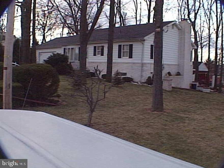 3 Bedroom Rancher on nice wooded lot.  Needs some light cosmetics.  Being sold as-is.  2 car garage with overhead storage.  Enclosed breezeway for extra finished area.