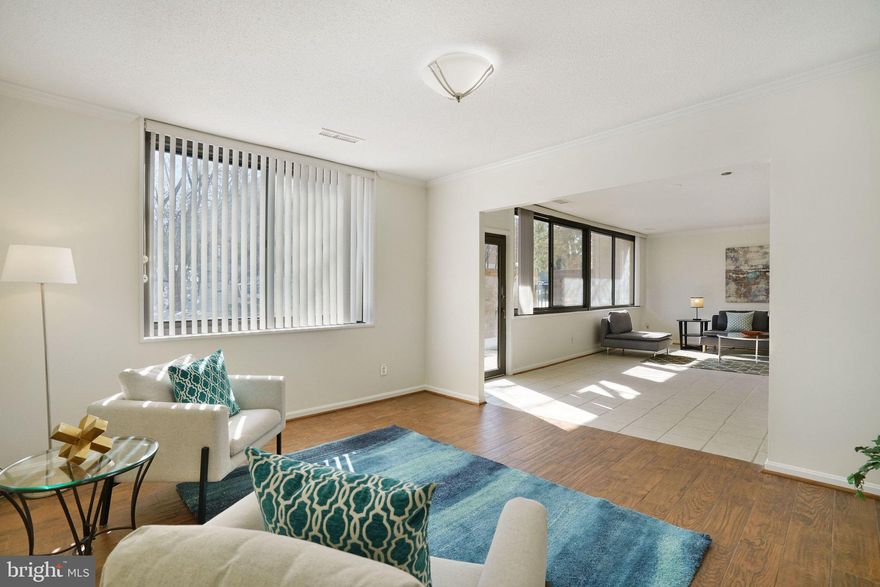 "Wow!",  "it's so bright!", and " there's plenty of living space here!" are just some of the comments that describes this 2079 sf end-unit UPDATED terrace patio-level condo home with 1 deeded garage parking, in sought-after Skyline House, Falls Church, VA.   With the east-southeast facing location of this unit and windows on 2 sides, the Eastham model with 2079 sf of living space is the largest floor plan available at Skyline House.  This condo home offers 3 sizeable bedrooms, 2.5 updated bathrooms, expansive living room with wall-to-wall windows and access to your own private terrace patio, a separate dining/den room, a large upgraded kitchen with IN-UNIT stacked washer/dryer, closet space galore, AND 1 deeded secured garage parking space with the option to purchase a 2nd secured garage parking space.   It's really all here!  Light and bright, this condo home has windows on two sides - there are only a few of these end-unit terrace models in the building! -  and a full glass patio door (windows and door replaced 2011) giving this unit a private serene vibe that will make you forget you're in the middle of an urban hotspot of Falls Church.   Kitchen features electric cooking, granite counters, lots of counter space, solid wood cabinetry, full size refrigerator, ample table space, and a stacked washer-dryer system.   All three bedrooms are large enough for a king-side bed and each feature sizeable walk-in closets and large windows.  Primary bedroom has ensuite bathroom.  A 2nd full bathroom and hallway half bath means no one is waiting in line for the loo!     2026 upgrades include replaced interior door hardware throughout, new kitchen cabinet hardware, replaced bathroom light and hallway light fixtures.  Interior is freshly painted in on-trend warm neutral color with upgrade-quality vertical blinds on every window, on-trend ceramic and vinyl plank tile flooring throughout, and no carpeting.   Skyline House is resort-style living with many amenities including an expansive recreation deck with large pool, tennis courts, several meeting and party rooms throughout, onsite management, 24/7 security and garage parking, to name a few, and plenty of resident activities that you'll never be bored!   Shops, restaurants, retail, fitness clubs, Fairfax County schools and services, and access to mass transit commuting options are all right outside the building lobby door.  If you're a foodie you will BE AMAZED of all the incredible choices of award-winning ethnic food restaurants and grocery stores within 2 miles.  Photos show previously staged rooms.  MLS listing information, Disclosures, Marketing Brochure with upgrade list and floor plans, and offer guidelines available online.  Condo Docs in hand.  Update items completed after photos were taken include new interior door hardware, kitchen cabinet hardware, ceiling lights.   2nd deeded garage parking space, PS505E, is available for purchase separately or can be considered part of the total unit sales offering.  Seller reserves the right to set an offer deadline and ratify on a sales offer at any time.   Listing agent lives in the area and can speak to the many amenities that makes Falls Church/Bailey's Crossroads/West End Alexandria the place to be.  So much to offer here, it's hard to resist and easy to see why Skyline House is THE place for YOU!