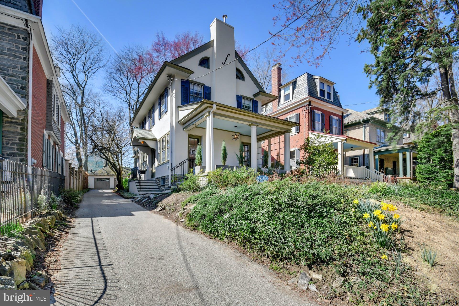 Wonderful opportunity to own a mid-sized single residence in a prime Top-of-the-Hill location!  Circa 1925 this handsome three-story stucco colonial offers a living room with a stone fireplace and two doors that lead to an open front porch  with a wall of planters and views of the professional landscaped grounds.   You will find a large dining room with ample extra space to watch the  included mounted TV.  There is a sunny kitchen with attractive cabinetry, butcher block countertop, ceramic tile backsplash, KitchenAid refrigerator & dishwasher, GE range and Viking microwave.  The property offers a convenient first floor laundry room with Whirlpool washer & dryer plus a rear exit that leads to the roomy Ipi Brazilian  wood deck and sweet rear garden.  On the second floor there are three bedrooms that include the lovely main bedroom with a mounted TV, an updated full bathroom with tile, wainscoting and tub/shower, a second bedroom with built-in bed, desk and cabinets and a third bedroom that includes two magnetic porcelain enameled steel white wall boards.  On the third floor is a bedroom/craft room that runs the length of the house and offers original built-in drawers & closets and includes a sink with running water.   The property includes central air condition and Sonos sound equipment plus a full unfinished basement with powder room and good storage space.   The former detached three-car garage is a very special feature of this property.  You will find usable space that measures 33' x 21' and includes a front door entrance, HVAC system and powder room.  This would make the perfect home office , work shop, exercise room or a myriad of other uses based on the new owner's needs.   If you still want to use the garage to park your car, there is a bay with automatic opener for one vehicle plus  the grounds allow for plenty of additional off street parking.  Just one block off of Germantown Ave this location is hard to beat!  So many desirable amenities - stroll to  the quaint shops, dine at the many local eateries, enjoy summertime concerts in Pastorius Park or hike along the gorgeous trails of the Wissahickon Valley to name just a few.