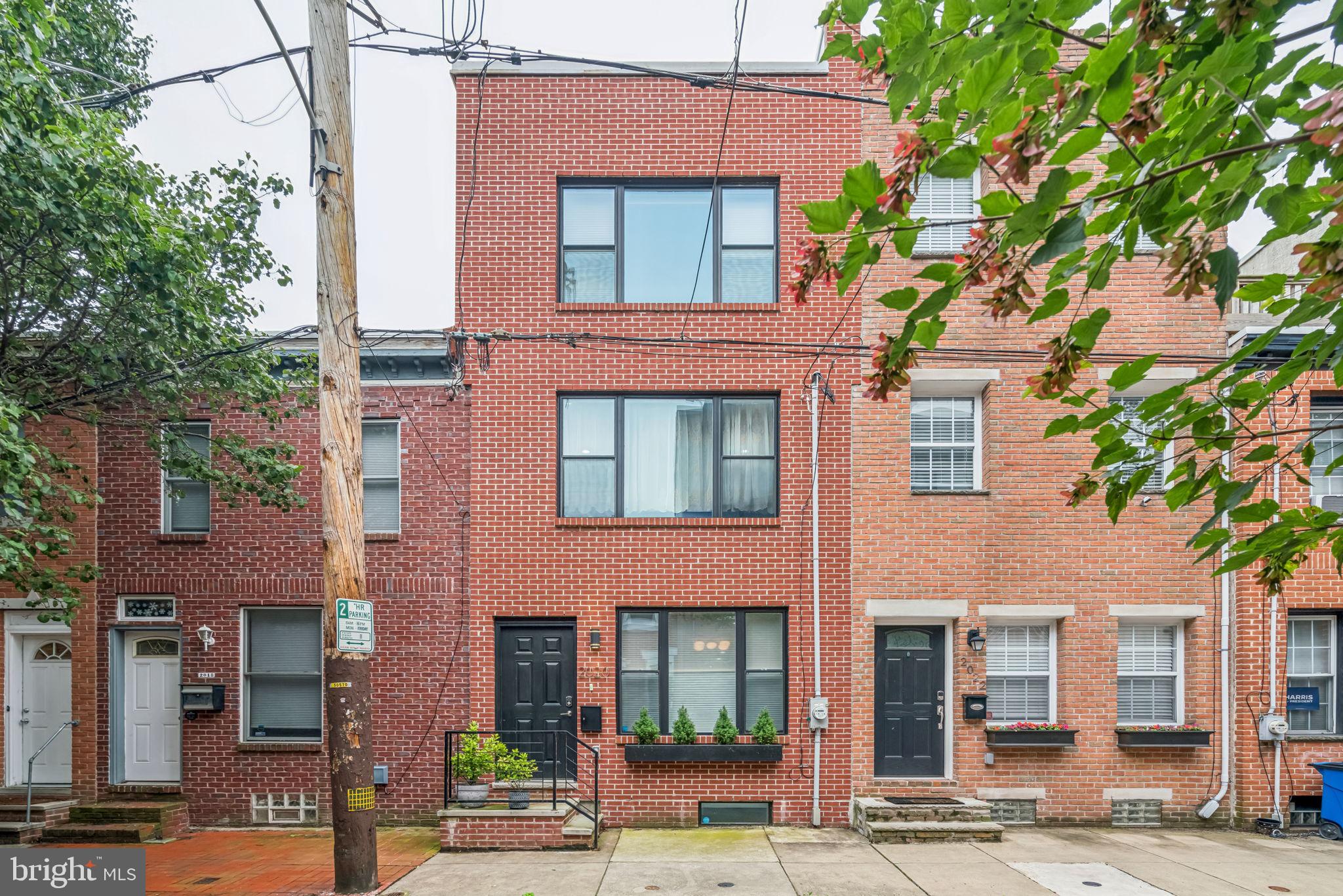Welcome to 2020 Saint Albans Street – a modern, newer construction home (completed in 2020) perfectly situated on a quiet, low-traffic block in the heart of Graduate Hospital. This beautifully maintained 3-story residence offers 3 bedrooms, 3 full bathrooms, private driveway parking for 1 car, and approximately 2,200 sq. ft. of thoughtfully designed living space.
The main level features an open-concept floor plan with wide-plank hardwood floors, oversized windows, and a chef’s kitchen outfitted with high-gloss cabinetry, quartz countertops, and premium stainless steel appliances—perfect for both daily living and entertaining.
Just below, the fully finished lower level with 8-foot ceilings and a full bathroom offers incredible flexibility. Whether used as a family room, home gym, guest suite, or office, it also presents the opportunity to expand your main living area, adding even more functional space to the first floor.
The second level includes two generously sized bedrooms, a full bathroom, and a laundry room for everyday convenience. The third floor is a full-floor primary suite featuring city skyline views, a spa-inspired wet room, dual vanity, and a custom walk-in closet by California Closets.
A spiral staircase leads to the expansive roof deck, where you'll enjoy sweeping Center City views—the perfect urban retreat.
Located just minutes from Ultimo Coffee, Sidecar Bar & Grille, Honey’s, South Street, and Rittenhouse Square, this home checks every box.