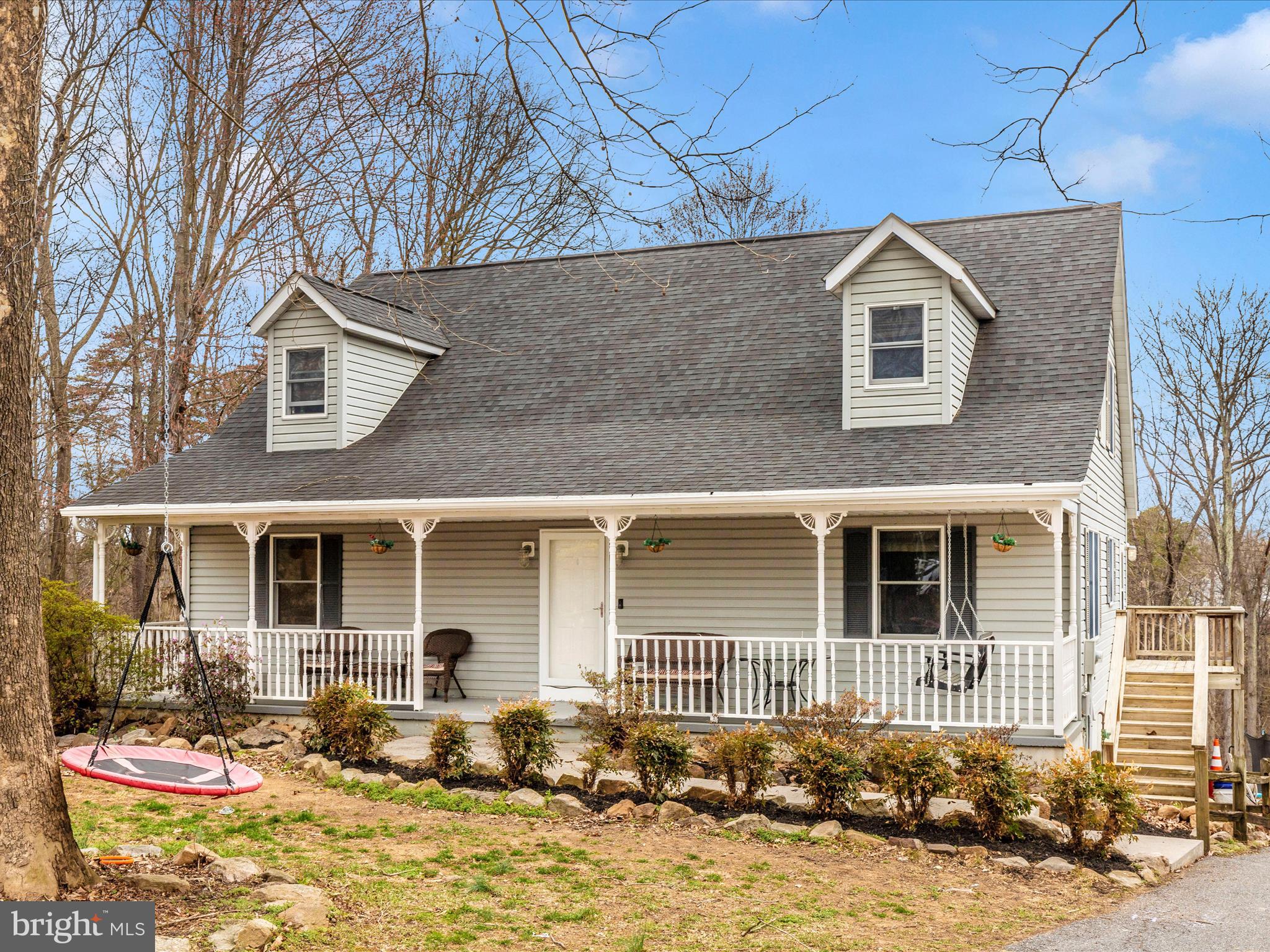 Welcome to 215 Regal Drive in Falling Waters, WV. This beautiful four-bedroom, three-and-a-half-bath Cape Cod is nestled on a 2.08-acre lot in the desirable Kingsbrooke on the Potomac community, coming with A RIVER lot lease that transfers for the new owner. Just in time for river season!
The main level features a spacious owner’s suite with a private bathroom, as well as an open living room and kitchen floor plan, creating a warm and inviting space perfect for entertaining. A conveniently located laundry room adds to the home's practicality. Upstairs, three additional bedrooms and a full bathroom offer plenty of space for family or guests.
The finished walk-out basement includes a bonus room, workout room, a full bathroom, and extra storage space. Additional attic storage ensures ample room for belongings. A rear-entry attached garage provides convenience and a clean aesthetic. Outside, beautiful landscaping enhances the curb appeal, while the large backyard and lovely patio area offer the perfect space to relax and enjoy the peaceful surroundings.
A small balcony on the back of the home offers the potential for a cozy outdoor retreat, with the existing board and structure, it has the potential for making for a full-sized deck.
This home is equipped with a central vacuum system, adding to its convenience and ease of maintenance.
This home offers a wonderful combination of privacy and convenience, with easy access to major highways, shopping, and dining. Don’t miss this opportunity to own a beautiful home in a sought-after community. Schedule your private tour today.