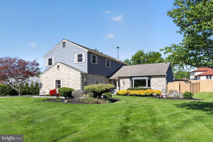 Welcome to 179 Carol Lane, located in the award-winning Council Rock School District and situated on over a half-acre in sought-after Spring Valley Farm. An inviting paver walkway greets guests and continues to the main entry, featuring an elegant 2-story foyer. A large bay window complements a spacious living room and provides abundant natural light for the adjacent dining room; both rooms are enhanced by hardwood flooring. A carefully designed and recently renovated kitchen (2023) features granite countertops, a charming farmhouse sink, range hood, custom tile backsplash, double wall ovens, a large center island with an additional sink, pantry, skylight, and a convenient breakfast bar. The kitchen overlooks a cozy family room that exudes warmth with exposed wood beams and a gas fireplace with brick surround. The main level also includes a well-appointed powder room and a laundry/mudroom that provides an additional exterior entry. Upstairs, the main bedroom suite includes triple closets and a newly upgraded primary bathroom (2023) complete with double vanity, walk-in shower with glass surround, custom tile, and pedestal tub. Three ample bedrooms, including one with updated flooring, share a hall bathroom with dual vanities. The finished basement is perfect for a myriad of needs and comes fully equipped with a built-in bar, pool table, and a half bathroom. Entry to the backyard oasis can be found through a bright and expansive sunroom, a space that will extend your enjoyment of the grounds deep into every season. This is truly resort-style living! A paver patio, complete with fire-pit and built-in grill, overlooks the heated saltwater pool and rear yard enhanced with a vinyl fence installed around the perimeter. A large rear shed is perfect for additional storage, and this home includes key utility improvements: a full house generator, a water softener system, and a leaf filter system. Book your showing today!
