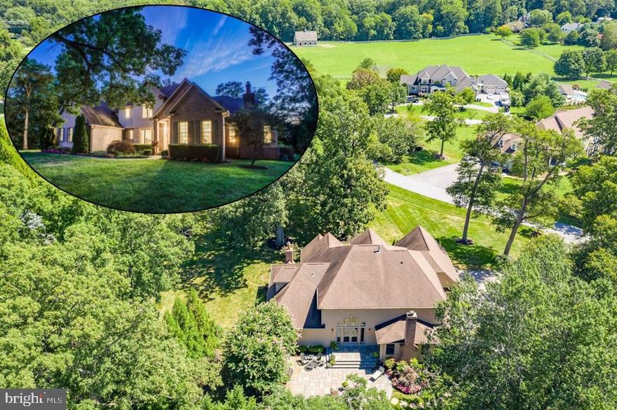 Sited on prestigious Paternal Gift Farm, this striking custom home is more than just small town living while preserving all the conveniences of a larger town, this house feels like home.  Exceptionally maintained and newly appointed, this home shows brand new, but offers the comforts of established neighborhood.  The attractive brick and HardiPlank exterior is complemented by professional, lush landscaping, extensive hardscaping, mature trees and private yard.  Upon entering, a soaring two story foyer welcomes you into a brilliant floor plan that allows for the versatility to curl up with a book in a cozy space, sip morning coffee in a sunny spot or entertain a party!  The main level boasts newly finished hardwood floors, custom moldings, fresh paint, and captivating views from impressive windows that enhance every room.  Retreat to the main-level Master suite boasting gas fireplace, private bath with soaking tub accented by custom tile, separate shower, granite countertops, dual sink vanity with curio cabinetry, and huge walk-in closet.  The family room features a two-story ceiling and French doors to massive stone patio.   Enjoy cooking dinner in the gourmet kitchen featuring new stainless steel appliances, center island with breakfast bar, granite counter tops and picturesque breakfast room.  An open-style dining room gives the flexibility to seat a crowd for dinner!  The living room provides comfort and convenience with a wood-burning fireplace with brick hearth and mantle, sliding door to patio, private access to family room and back staircase to upper level.  Private-level living is complete with four more spacious bedrooms, each with brand new carpet, fresh paint, private full bath and over-sized closet.  Lower level with huge recreation room, recessed lighting, tons of storage, walk-up and plenty of space for more rooms!  Surrounded by nature, easy access to scenic pathway through neighborhood and horse pastures, newly finished hardwoods, new carpet & paint throughout, new appliances, furnace, water heater, and minutes from Boarman's Market, Post Office; Highland Vet and Groomery. This home truly has it all!