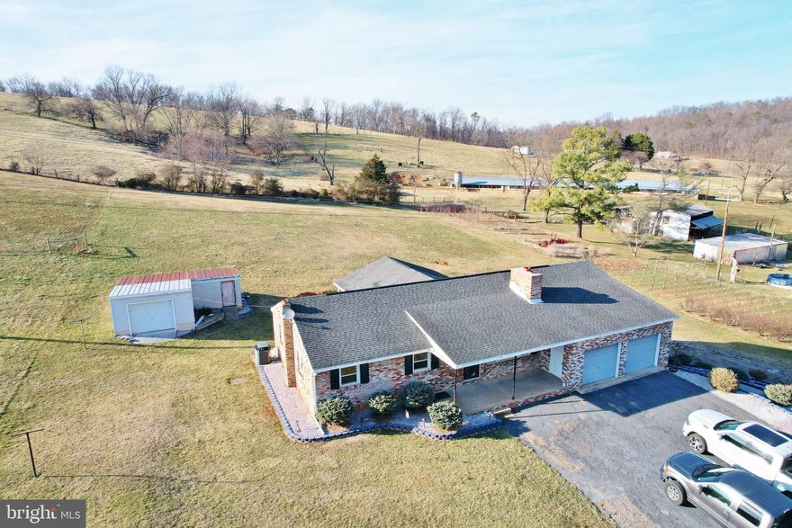 Make this All Brick Ranch Home Your Dream Come True!  It's a Country Retreat in the Heart of Quicksburg and only 2 miles to I-81.  This property contains 1.29 acres, with room to plant a garden and grow your own food. This home has so much to offer inside and out! Four attached garage spaces, yes (4)! Large Florida Room off the Kitchen. Another Large Family Room Off the Main Level Garage and Kitchen! This residence having 1,750+ sq. ft. on the first level and partially finished full basement is waiting for your finishing touches.  There is so much potential to make it the dream home you have always wanted with the convenience of being just over 20 minutes to Harrisonburg. Hear the wood crackling in the all brick fireplace in the Living Room, Plus a second brick fireplace/wood burning stove in the basement Rec. Room.  Make your appointment today to view this property!