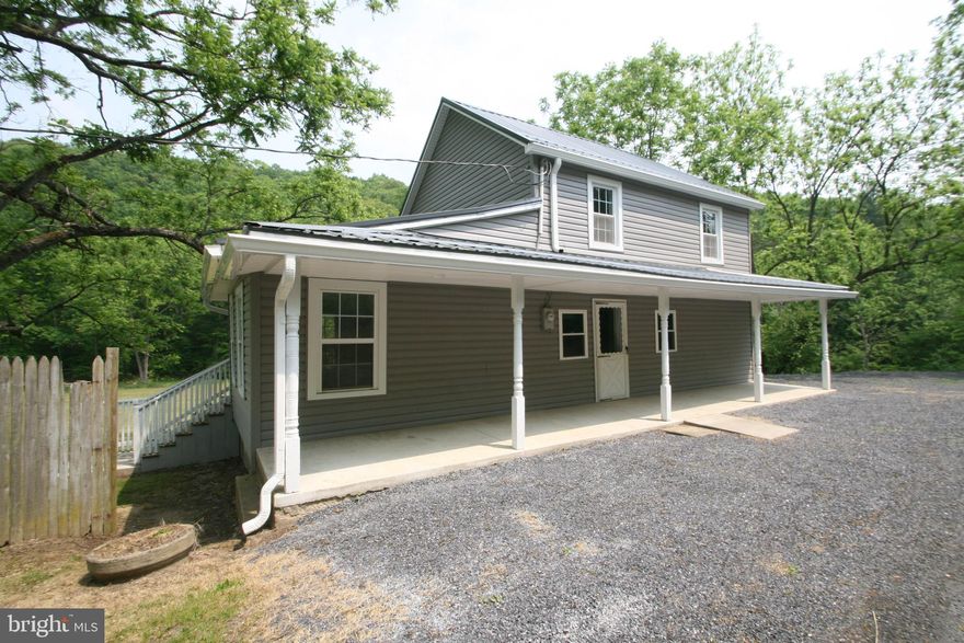 A very nice remodeled country house. Move-In ready! Large yard to view off the rear porch. Eat-in kitchen with an area for separate dining. Laundry on first floor bath. Seller has a passed perk test and installed the first part of the system. Sand mound can be installed in the spring after all the permits and process has been completed. House can be occupied in the mean time with what has been installed.  Enjoy peace and quiet with easy access to all the area has to offer. East Broad Top Railroad a short distance away. Raystown Lake