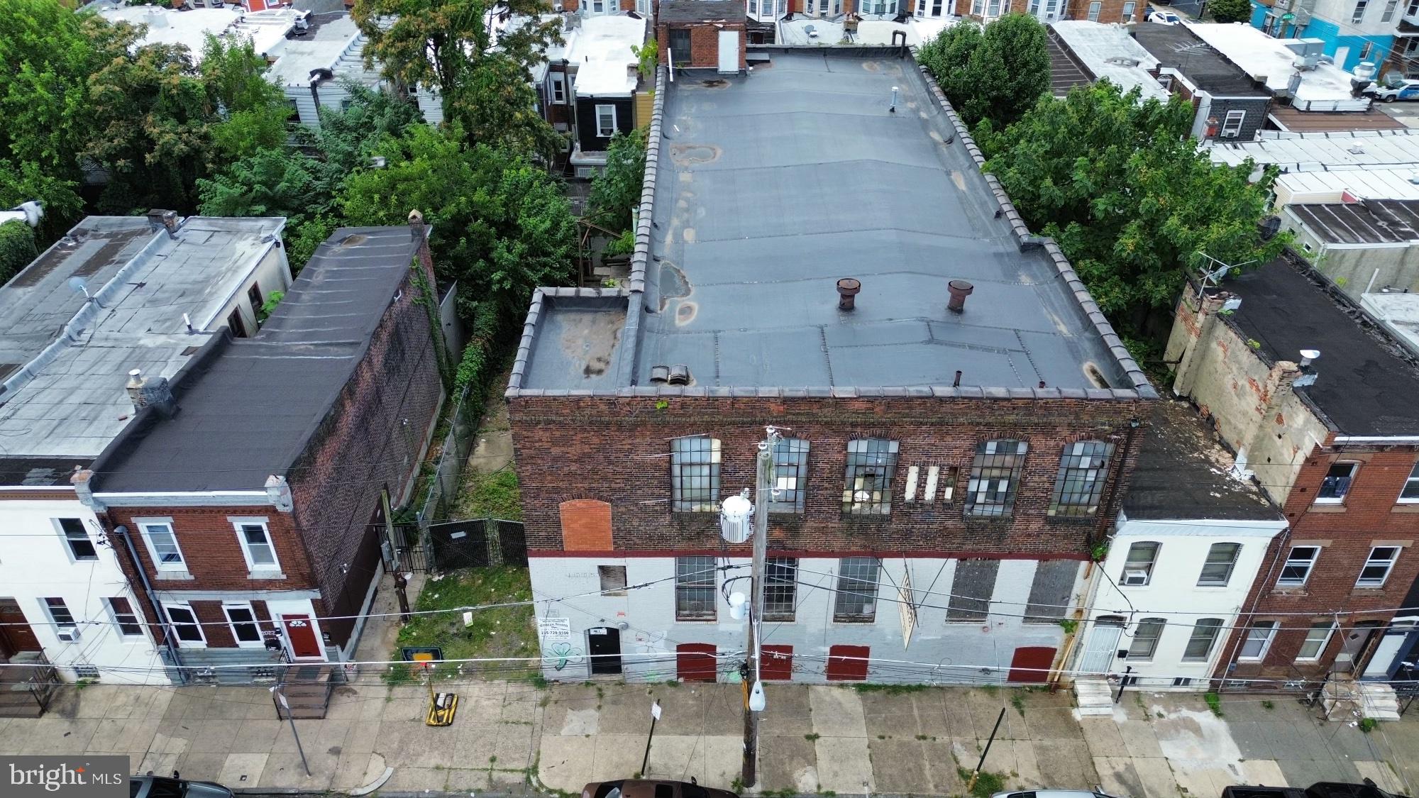 Explore a unique opportunity to own a piece of Philadelphia's commercial history with this distinctive warehouse, originally the flagship location for Ed London's renowned silk flower shop. Spanning 12,464 square feet, this impressive building boasts 14-foot ceilings, working freight elevator, plus, a convenient driveway with curb cut leading to an attached garage and loading dock providing ample room for various uses such as, storage, community and creative spaces, fitness facility, breweries, coworking spaces just to name a few. Or even convert this building into residential units! Additionally, the seller installed a brand new sprinkler system and a new roof pre covid. The property offers easy access to major transportation routes, making it an exceptional choice for any business. Don't miss this opportunity to start generating income in this highly sought-after space!
