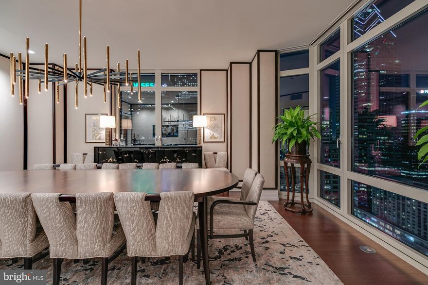 Introducing Unit 2803, an impressive 5,000 square foot corner residence in the highly desirable and prominent 10 Rittenhouse Condominium. This remarkable home offers incomparable views and exquisite finishes that truly set it apart. Uniquely, this is the only floorplan of its kind in the building, occupying half a floor with extraordinary views sweeping from Rittenhouse Square across the City Skyline, placing it in a class of its own.

As you enter, a grand foyer opens into a gracious gallery that elegantly separates the entertaining areas from the four spacious bedrooms. The tremendous living room features enormous windows, bathing the home in warm, natural sunlight. Enjoy a private, enclosed balcony off the living room, offering a comfortable outdoor sitting area overlooking Rittenhouse Square. Adjacent, an office with custom shelving and views of the square can be accessed through pocket doors.

Along the north side of the residence are three impressive bedrooms with en-suite bathrooms and walk-in closets, a media/tv room, and a magnificent dining room ideal for dinner parties. The adjacent eat-in chef's kitchen boasts a kitchen island and high-end appliances.

The secluded and serene owner's suite occupies the most private corner of the home, featuring its own terrace with views of Rittenhouse Square. The owner's bathroom includes a walk-in shower, two separate vanities, heated floors, and a private water closet, complemented by a pair of customized walk-in closets.

This home is equipped with modern features such as motorized shades, automated lighting, a security system, nine HVAC zones, and an integrated Crestron sound system. Residents enjoy five-star amenities including concierge services, doormen, a pool, fitness center, business center, and a chauffeur-driven BMW 740i. Two onsite garage parking licenses are included.

Beyond the luxurious interiors, the location offers tremendous convenience. You are just moments away from the prestigious University of Pennsylvania and Drexel University, as well as the major transit hub of 30th Street Station, providing excellent connectivity. The vibrant neighborhood of Rittenhouse offers a wealth of shopping and dining options, ensuring a dynamic urban lifestyle at your doorstep.