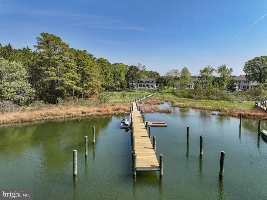 Fabulous in-town St. Michaels waterfront property – This coastal style waterfront residence, built in 2020, offers approximately 3,000 square feet of thoughtfully designed, sophisticated yet relaxed waterfront living space on San Domingo Creek. Located within town limits, the property enjoys direct access to the St. Michaels Nature Trail, allowing effortless walkability to shops, dining, and cultural amenities—no car required.
Designed for both comfort and entertaining, the light filled interior features an open floor plan with high ceilings, a well-appointed chef’s kitchen, and a welcoming fireplace. Four private bedroom suites – including a primary suite on the main level - make it a breeze to accommodate larger family gatherings and visiting friends. A spacious screened waterside porch, heated inground pool, deck and Bocce Court extend the living space to the outdoors for seasonal entertaining and warmer weather fun.
A separate pool house/studio, connected by the screened porch and breezeway, includes a full bath and offers flexibility for use as a home office, creative space or additional guest quarters.
The 2.3 acres lot is located at the edge of the San Domingo Cove community and is adjacent to protected woodlands, providing privacy, and offers with public water and sewer and a fully fenced backyard. Boating enthusiasts will appreciate the dock (shared with one neighboring property), offering two dedicated slips and a floating dock per owner and water depths of approximately 4–4.5 feet at the slips and 3 feet at the floating dock. From here it is easy to boat to Tilghman Island and Oxford, and San Domingo Creek is also great for kayaking and canoeing. 
An exceptional and rare opportunity to enjoy refined, in town waterfront living in one of Talbot County’s most sought after communities.