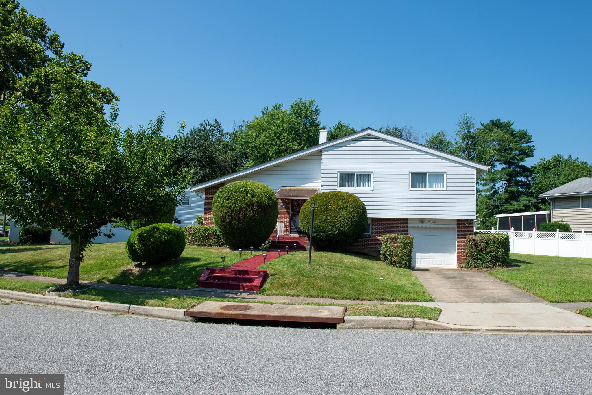 Luxurious 3 BD, 2 ½ BA Brick and Aluminum Siding Split Level with Attached Garage and 2 Car Parking Pad. The Huge Yard with patio is built for entertaining. This Shirley Hills Community is close proximity to 695, Liberty Road corridor, bus routes and subway station.
Newly remodeled Kitchen with New Quarts Counter Tops, New soft closing Cabinets and all new appliances - dishwasher, microwave, self-cleaning oven, and garbage disposal - (fridge approximately 4 years young). The entire house has been repainted. Spacious Living with Cathedral Ceilings and New Carpet. Dining Room has New Carpet and leads to New Patio Doors. New Luxury Vinyl Plank (LVP) Flooring in Kitchen, Foyer, Family Room, Powder Room and Laundry Room. Three spacious bedrooms with updated hall bath. Master Bedroom has master bath and two spacious closets (AC wall unit – AS IS). Family Room on lower level has a powder room and door leading to the garage. There is also a huge storage space under the main level. Spacious laundry room with new HVAC (washer and dryer AS IS). All Major Systems has been updated – New HVAC, Mostly All New Windows and Blinds, Roof and Patio Roof top has been replaced over the years.