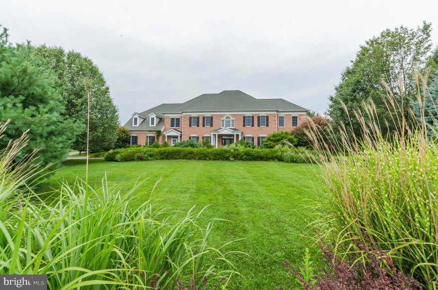 Stunning and spacious floor plan with open spaces, high ceilings, gourmet kitchen, hdwd flrs, main lvl office. Lux master suite w/ lrg closet and bath. All BR's en-suite. Fully finished LL w/ 5th BR & full bath. Generous deck leads to screened porch overlooking private level yard.