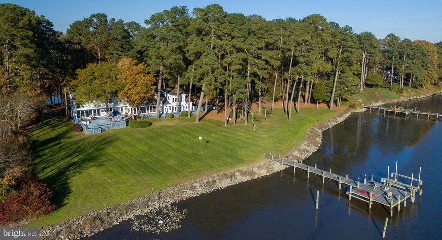 Spectacular Waterfront with stunning panoramic views of the Wicomico River, private pier with boat lift, and rip-rapped shoreline! This Extraordinary one owner property boasts a 4573 Sq Ft, 4 bedroom, 3 full bath, 2 half bath residence situated proudly on 2 acres at the point where Rockawalkin Creek enters the Nithsdale Community from the river. Vast stretches of natural habitat across the river allow you to experience nature's most impressive creations from Stunning Sunsets to Incredible Wildlife! Witness the aerial finesse, dramatic dives for fish, and exotic calls from the many bald eagles nesting there. Enjoy access to the Chesapeake Bay, boating, water sports & endless fishing right from your private pier. An impressive home for entertaining, and a sanctuary for personal time, you will truly never want to leave!  Enter this immaculate home to find spacious open living areas that flow throughout the first floor and carefully accentuate the sweeping waterfront views from every angle! Natural light floods in through walls of windows and sliding doors. Incredible multi-level decks span the entire rear of the home and invite you to live outdoors as much as indoors! Gorgeous foyer and open living room pays tribute to the waterways with a distinctive inlaid seashell wall. Cozy up to the gas fireplace in winter and enjoy decorating the seasons on the stone hearth. Sunny kitchen, central to all of the living and dining spaces, is freshly updated with bright white cabinets, gorgeous new white quartz counters, new hardware & offers gas cooking. Casual dining space and a formal dining room offer many options for serving meals and chatting with friends over coffee or wine! The great room showcases soaring ceilings, comfortable seating areas & quaint conversation spaces, plus roomy storage closets perfect for hiding all the things you need to put on the best parties ever! Many charity events have been hosted in this home and incredible memories made! The 1st floor continues along the waterfront with a beautiful sunroom currently used as an office & workout room. Functional spaces like a 1st floor laundry room & lrg mudroom are a key component in this home as well! A full bathroom on the 1st floor offers guests a great space to freshen up. Upstairs in the main home you find a gracious master suite with sliding doors to the 42' balcony, carefully designed with clear paneling to maximize the view &  the perfect size to provide sun shading to windows below without obstructing the view. Impressive master bathroom offers dual vanities, fully tiled private shower area & soaking tub. Walk in closet & two additional closets offer the owners ample space to stay organized & clutter free. Two additional guest bedrooms offer spacious quarters, roomy closets & each have private access to the full bathroom with dual sinks, new tile floors, and separate shower area. A walk up attic provides easy storage space. The addition built in 2014 brought the gorgeous sun room and 2nd floor 4th bedroom, originally designed as an Art studio. This versatile area, with sep. stairs, is almost a house of its own and would be the perfect in-law quarters or second owner's suite! Huge open spaces, tall angled ceilings, lots of track lighting,and a charming conversation nook all overlooking the serene waterfront provided the current owner endless hours of inspiration. A dressing room, currently with 1/2 bath fixtures was designed with full bathroom conversion in mind. Many updates- full list attached to listing - key highlights include: new BAT septic system in 2015 all 5 heat pumps have been updated, prof. lawn care, wireless alarm, 2 water treatment systems - home & irrigation. Black top driveway, 2 car attached garage. Septic may be rated for 3 BR. This private home site is situated at the end of a cul-de-sac in one of Salisbury's most sought after communities. Don't miss one of Delmarva's most Magnificent Waterfront Homes!