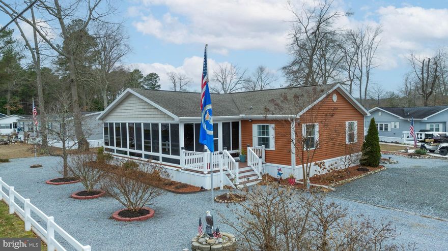 Welcome to your dream home at 25942 Atlas St, Millsboro, DE, where comfort meets convenience in this spacious mobile/manufactured residence. With 2,016 square feet of thoughtfully designed living space, this home offers an ideal blend of functionality and style.

As you step inside, you'll be greeted by the incredible 4 season room where you will enjoy living your best life at the beach! Stepping into the main body of the home the inviting floor plan seamlessly connects the living, dining, and kitchen areas, perfect for entertaining or enjoying quiet family evenings. The generous living room provides ample space for relaxation and gatherings.

This home features three well-appointed bedrooms, offering plenty of room for family, guests, or a home office. The primary suite is a true retreat, complete with an en-suite bathroom for added privacy and convenience. The custom shower and tile work, as well as the jetted soaking tub are sure to knock your sandals off! Two additional bedrooms share a second bathroom, ensuring everyone has their own space.

The kitchen, a true heart of the home, boasts ample cabinetry and counter space, making meal preparation a breeze. Just off the kitchen, you'll find a dedicated dining area that invites leisurely meals and memorable moments.

Outside, enjoy the peace and tranquility of your surroundings, with plenty of outdoor space for gardening, recreation, or simply soaking in the fresh air. Sit back and enjoy the stars while relaxing by the outdoor firepit! Located in Long Neck, this property offers easy access to local amenities, shopping, and dining, as well as plenty of water access for you boating enthusiasts. 

Discover the perfect combination of space, comfort, and location at 25942 Atlas St. This home is ready to welcome you with open arms. Don't miss your chance to make it yours!
