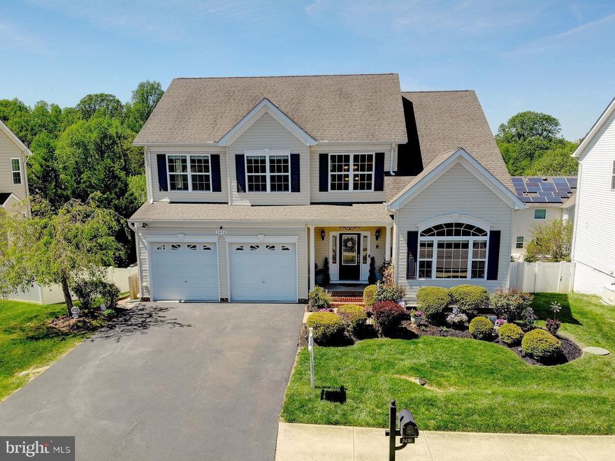 This beautifully maintained home is located in the highly sought-after Chesapeake Village community! The spacious primary suite is a true retreat, featuring two walk-in closets, a luxurious soaking tub, separate tiled shower, and double vanities. The heart of the home is the stunning kitchen, complete with granite countertops, a large center island, stylish, tiled backsplash, built-in microwave, gas stove, and double ovens—perfect for both everyday living and holiday entertaining. Sliders off the kitchen lead to a bright and inviting sunroom overlooking the backyard, enclosed by a low-maintenance vinyl privacy fence with both double and single gate access. Enjoy hardwood floors throughout the main level, and relax in the cozy family room featuring a gas fireplace and surround sound system just off the kitchen.  The freshly painted interior continues into the fully finished walk-out basement, offering a bedroom, full bath, and spacious recreation room—perfect for guests, extended living, or entertaining.  Step outside the basement sliders to your private outdoor oasis with a new patio and a hot tub surrounded by privacy fencing—ideal for unwinding or hosting guests. Additional peace of mind comes with a transferable Cinch home warranty, which even includes the hot tub.  Enjoy the vibrant community, known for its festive events all throughout the year. Enjoy access to Brownie’s Beach (Bayfront Park), keep your boat at the nearby Rod 'n Reel Marina, and take in summer concerts by the water. Conveniently close to restaurants, shopping, top-rated schools, and an easy commute to Joint Base Andrews and Washington, D.C. This home truly has it all—space, comfort, and community!