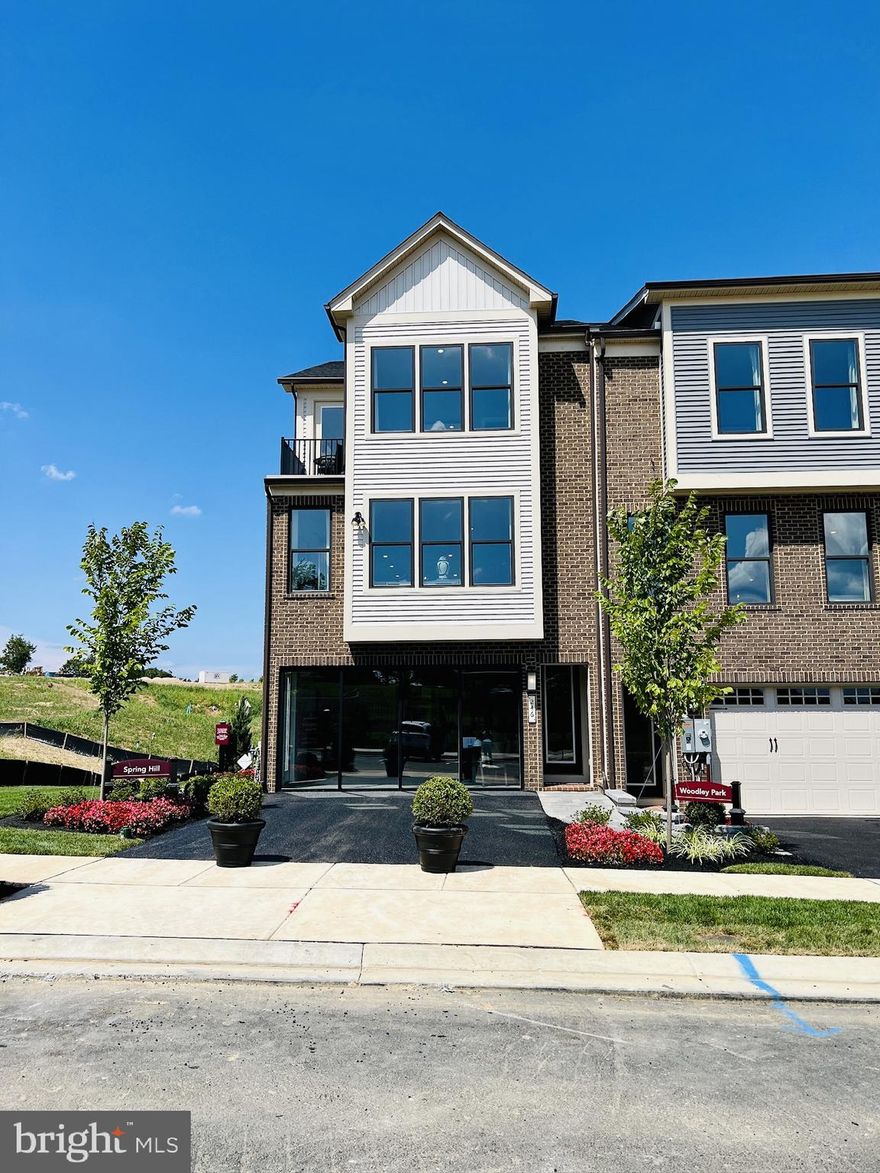 Welcome to 246 Hickory Hollow Court, a sophisticated NVHomes “Spring Hill” model home in Cockeysville’s Longview Ridge community. This 3 bedroom, 3 full bath, 2 half bath, approx. 2,618 sq ft luxury end-unit townhome is loaded with upgrades, including wide-plank LVP flooring on the main level, a chef’s kitchen with oversized island, quartz countertops, designer backsplash, wall-mounted hood, and expanded cabinet layout. The open-concept great room flows to a covered outdoor living area that functions as an additional space for lounging or dining. Upstairs, the double-door owner’s suite features a spa-inspired bath and generous closet space, along with two additional bedrooms, a stylish hall bath, and convenient bedroom-level laundry. The finished lower-level recreation room with half bath provides flexible space for a home office, gym, or media room. Exterior features include a 2-car garage with painted floor, asphalt driveway, brick paver walkway, upgraded landscaping, and energy-efficient systems. All of this in a convenient location just minutes to Wegmans, Hunt Valley Towne Centre, I-83, and nearby parks and trails. Model-home upgrades throughout—move in and enjoy.