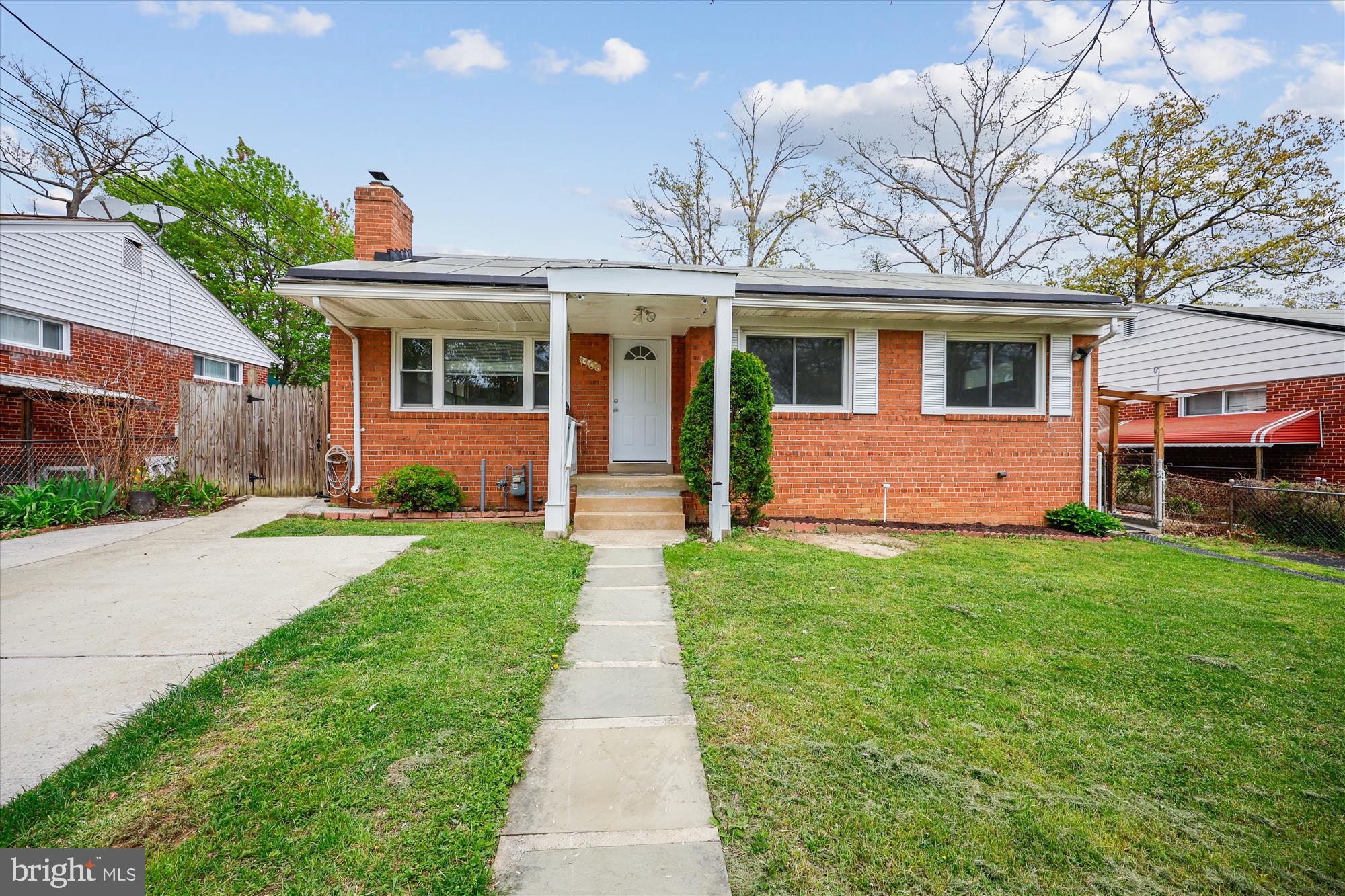 Charming Brick Home with Spacious Layout and Outdoor Oasis.
This beautiful brick home offers 3 bedrooom/den or 4 bedrooms on the main level, 2 full bathrooms, a spacious living/family room with wood-burning fireplace, formal dining room, separate kitchen, and a cozy sunroom that leads to the backyard. New HVAC and Roof. The expansive lower level features a large family/rec room, abundant storage space, and mini-kitchen with a separate outdoor entrance. Enjoy the outdoors in the large, fenced backyard—perfect for gatherings, gardening, or pets.
