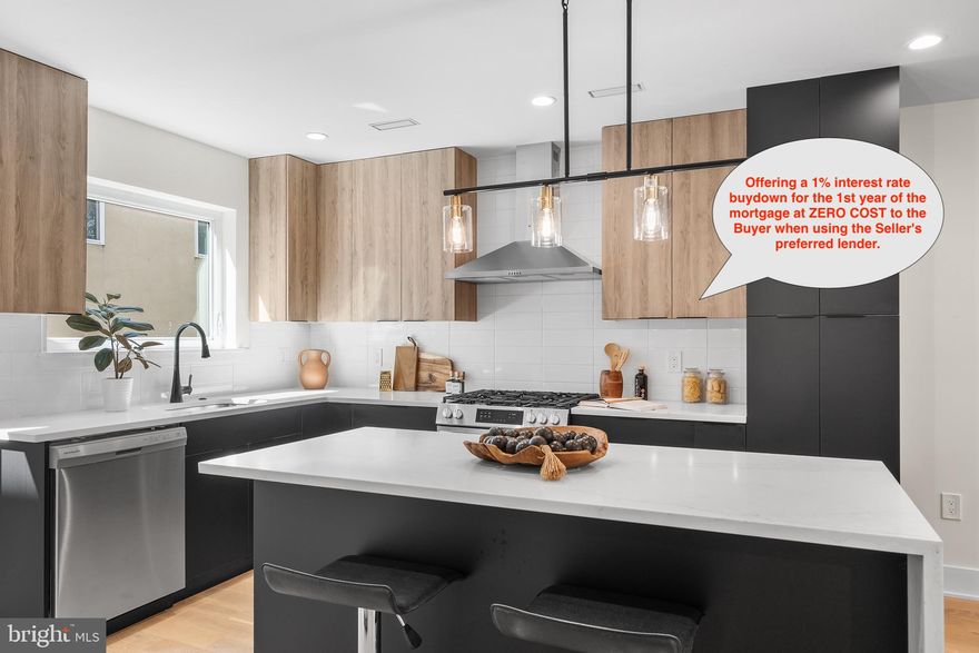 This property offers a 1% interest rate buydown for the 1st year of the mortgage at ZERO COST to the Buyer when using the Seller's preferred lender. Seller is also offering additional buy down or closing cost assistance. Call now for details. Phenomenal new construction value located on quiet Queen Village street with FULL 10 year tax abatement (not the newer, watered down version). Seller will include one year of parking valued at $250 / month (the space is immediately adjacent to the house). Upon entering the house you'll be in the main living area featuring gorgeous wide plank engineered wood floors (exceptionally durable), full living room, dining room, eat in kitchen and powder room. The expansive kitchen features Carrera style quartz surfaces, wrapped island with microwave shelf and room for 4 stools, semi-custom two tone euro style cabinets, range hood, whirlpool and Frigidaire appliances, Alexa enabled sink, powder room, and access to the rear yard (steps to be completed). On the lower level the fully finished basement makes a great media room, home gym, office or future bedroom with all the plumbing for an ensuite bath where the large storage room is currently. The second floor features two bedrooms, each large enough to accommodate queen beds, full closet, wall mounted tv connectors and the hall bath with subway tile flooring complemented by porcelain tile bath surrounding the soaking depth tub. The third floor master suite is fully private, offers a bedroom that is king bed compatible, full bath with luxurious oversized walk in shower in black and white ceramic tile, oversized floating vanity, his and hers closets, and laundry room with utility sink and space for side by side washer/dryer. The show stopping fourth floor lounge has all your entertainment and chill out bases covered with kitchenette, ice machine, beverage fridge, roof deck overlooking skyline in 3 directions, hose bib and electric (no venting stacks visible to obstruct your skyline views) and powder room. Install your wall mounted TV above the kitchenette and this is simply one of the best Game Day rooms in town - bar none! This amazing home also features LED recessed lighting throughout, Ring enabled entry camera, dual zone HVAC, fully sprinklered, and tankless water heater. Make your appointment today. You will not be disappointed.