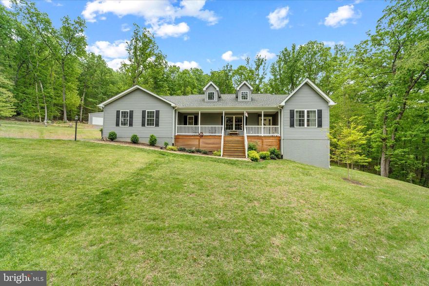 Welcome home to this beautifully maintained 2,328 sq ft single‑family retreat, perfectly sited on 13 private acres that connect directly to a conservation area and the Appalachian Trail — offering unmatched privacy, natural beauty, and endless outdoor adventure right from your own backyard.
Interior is spotless with bright open concept .  Large kitchen with an abundance of cabinets!  Large island perfect for entertaining or prepping.  Living area open to formal dining, propane fireplace. The home is equipped with a 22kW whole‑house Generac generator powered by propane, ensuring uninterrupted comfort year‑round. A propane fireplace adds warmth and ambiance, and the whole‑house central vacuum system brings convenience to every level. Hardwoods throughout are impeccable.  Main level laundry with front load washer and dryer.  
The lower level offers incredible potential with a walk‑out basement, bath rough‑in, and plenty of space to finish to your vision — whether that’s a guest suite or recreation room. Walk outside and rock on your front porch or dine and enjoy the views from your covered deck in back.  
Property currently uses satellite service, but Starlink is available, and fiber has just been run to the end of the driveway, giving future owners multiple high‑speed choices.
Water quality is a standout feature with a whole‑house filtration and softener system already in place.
Outdoors, the possibilities are endless. A massive 30' x 40' outbuilding with two 10‑ft bay doors and full electric is perfect for car enthusiasts, equipment storage, hobbies, or a home business. The acreage provides privacy, wooded beauty, and direct access to miles of protected land — ideal for hiking, wildlife watching, and embracing the peace of nature. Additional perks include No HOA.  Last home on private drive for ultimate privacy. Welcome Home to beautiful Bluemont!!!