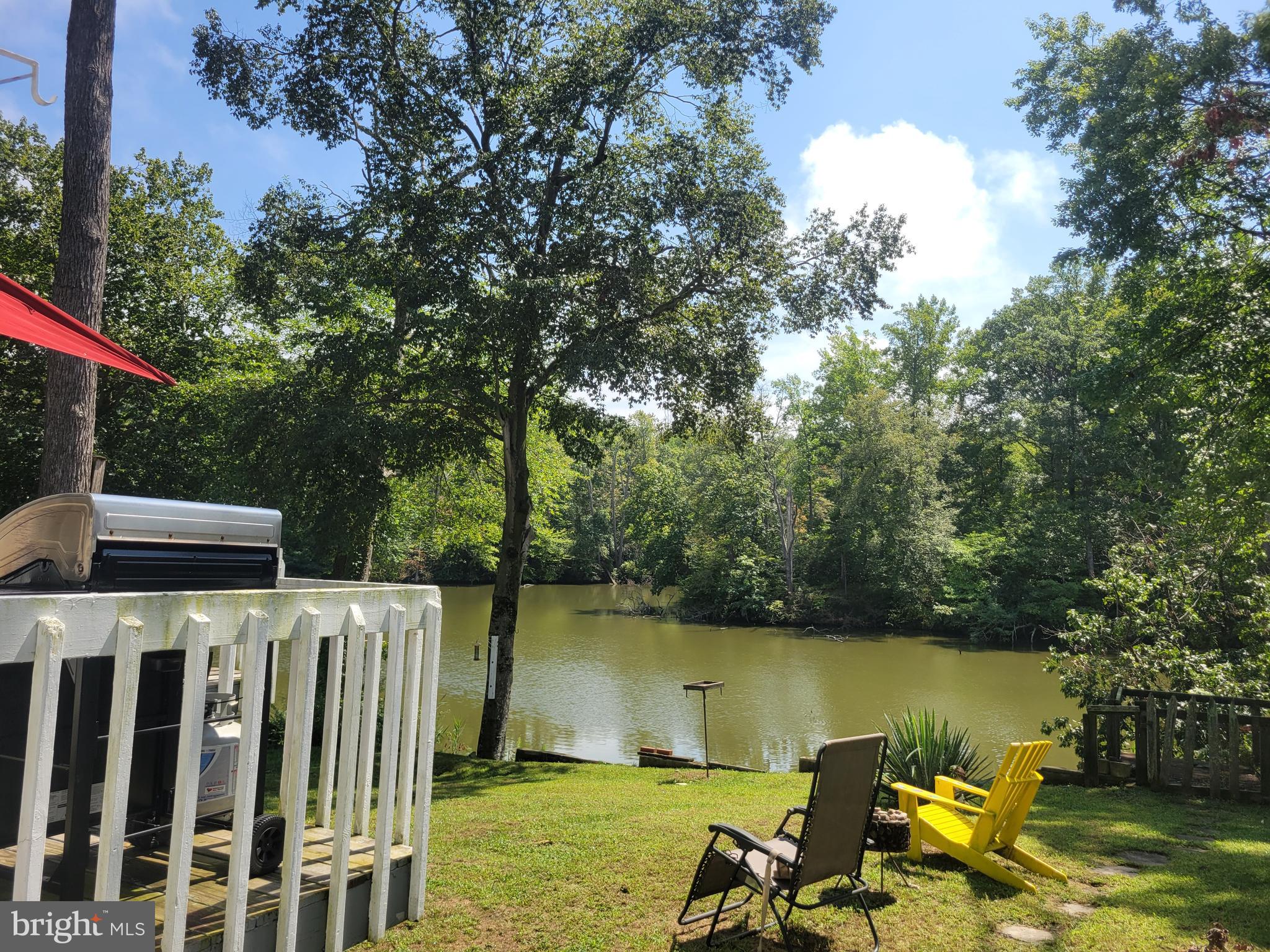 HUGE PRICE ADJUSTMENT!  LOOKING FOR UNOBSTRUCTED WATER VIEWS, LOOK NO FURTHER.  THIS LOVELY HOME IS EXACTLY WHAT YOU'VE BEEN WAITING FOR.  THIS 2 BEDROOM, 2 BATH HOME OFFERS MANY TRADITIONAL  AS WELL AS CONTEMPORARY TOUCHES TO MAKE ANYONE  FEEL WELCOMED.  LOCATED IN A WELL ESTABLISHED COMMUNITY JUST MINUTES FROM ANNAPOLIS, ALL MAJOR HIGHWAYS AND INTERSTATES.  RESIDENTS OF WOODLAND BEACH ENJOY SANDY BEACHES, COMMUNITY PIER AND DOCK, CLUBHOUSE, BOAT RAMP PRIVILEGES AND MORE.   THIS HOME IS PERFECT FOR WATER LOVERS OF ALL SORTS.  DROP A KAYAK OR BOAT FROM YOUR BACKYARD AND START YOUR JOURNEY.