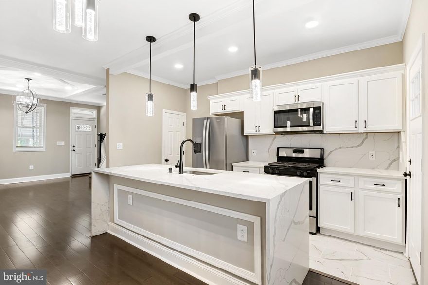 Step into this beautifully updated two-bedroom, one-bath home in the heart of Baltimore City, featuring high-end finishes throughout. Enjoy your morning coffee on one of two private balconies or relax on the welcoming front porch. Inside, you’ll find new appliances, elegant quartz countertops, and the warm ambiance of an electronic fireplace. Plus, you’ll have the convenience of off-street parking. Perfect for those who appreciate a touch of luxury and comfort in every detail.