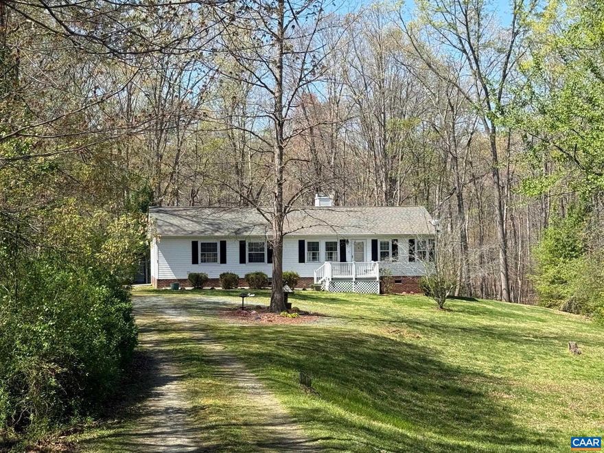 OPEN HOUSE SUNDAY 1-3 pm. Our 1,456 sq ft home sits back on a 1.84 acre lot behind the old Greenspring's Elementary school. We feature 3 bedrooms, a family room with a propane log fireplace, laminate wood floors, a screen room looking across the woodlands at the rear, a 2 vehicle carport with a storage shed and a relaxing rear deck. There is a recent new roof and windows, vaulted ceilings and ceiling fans.,Formica Counter,Oak Cabinets,Wood Cabinets,Fireplace in Family Room