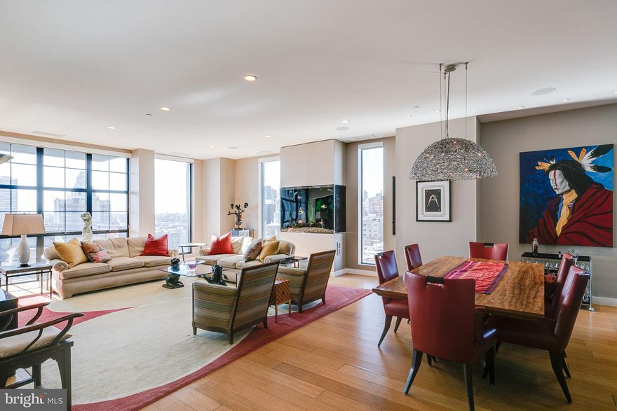 An absolutely stunning 3 bedroom, 3 bathroom condo at Old City's 108 Arch Street Condominium, an exquisite 30 unit boutique building with luxury finishes and amenities throughout. Unit 1002 has a private elevator entrance and is an amazing single-floor unit that spans 2517 square feet and features 3 large beds, 3 full baths, a fish tank, a large private patio, a parking space and amazing natural light with stunning views of the Delaware River, the Benjamin Franklin Bridge, Center City skylines and practically 360 degree views of the city. You enter your unit through the high speed elevator into an expansive foyer. You immediately notice the 10' ceilings, gorgeous bamboo floors, and amazing natural light pouring in through the floor-to-ceiling windows. The foyer leads you to the open floor plan with a massive living room featuring a lovely fish tank (formally a fireplace that can be converted back). The living room opens up to a large dining area with a beautiful chandelier and your large and contemporary kitchen featuring Viking Gas stove, double Fisher & Paykel dishwashers, Sub Zero fridge and a large Viking wine fridge as well as an oversized island, pantry and range hood. The living room also provides access to your south-facing private patio allowing for fresh air and outdoor entertaining! The first of the 3 bedrooms is extremely spacious and offers views of the Delaware River and is currently set up as an office/study. The full hall bath has luxurious and modern finishes, including floor-to-ceiling tile and a stand-up shower stall with a glass shower door. Across the foyer you will find two hall closets and a laundry room with cabinetry. The guest bedroom overlooks the Benjamin Franklin Bridge and is spacious, offering a reach-in closet, an en-suite bathroom with single vanity, soaking tub and floor-to-ceiling tile. The primary bedroom offers amazing light coming with west and north facing exposures featuring views of the Benjamin Franklin Bridge and Center City skyline. The large bedroom also features a large walk-in closet with custom closet treatments. The 5-piece en-suite bathroom is massive and features an oversized double vanity, a soaking tub, a stand-up shower stall with waterfall shower head, floor-to-ceiling tile, a toilet closet and a linen closet. Nestled in the heart of historic Old City, this condo is surrounded by some of the area's best restaurants, nightlife and attractions. The famous Elfreth's Alley is only a block away, Race Street Pier is under a 10 minute walk, and it is extremely accessible to the Benjamin Franklin Bridge, I-95 to get in and out of the city. A concierge staff is on site Monday through Sunday for additional convenience. All square footage numbers are approximate and should be verified by the buyer. It is the responsibility of the buyer to verify real estate taxes.