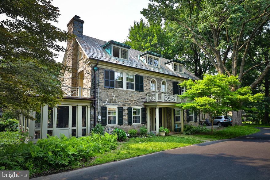 Charming, homey, bright, spacious, elegant, serene.  When you visit, you will feel the happy vibe of  this three-story center hall stone colonial located in the heart of West Mount Airy.   The location offers easy access to Chestnut Hill , the Wissahickon Valley, Mount Airy Village,  Weaver's Way Co-op, the regional rail lines, and Center City.  The house has much to offer.  Great light, renovated baths, beautiful kitchen, large living room with wood stove, screened porch, central air on the second and third floors, and lovely gardens. Enter the front door from the shared driveway.  To the right is the romantic kitchen/dining area with two doors to the outside, beautiful Carrara marble counters, a spacious island, Miele dishwasher, commercial style stainless sink, pretty and practical decorative and task lighting, and hardwood floors that make a seamless transition from kitchen to dining area.  To the left is the large, light-filled living room, with charming fireplace and mantel, and practical woodstove that will beckon family and friends all winter long.  Straight back from the front door, you will find the half bath, and another door to the yard. The first floor is completed by the screened in porch, so appealing in the summer months for eating and relaxing.  On the second floor you'll find four beautiful bedrooms, and two full bathrooms; one in the hall and one en suite for the primary bedroom.  The laundry also occupies a convenient location on the second floor.  The third floor consists of two more bedrooms and one more full bath.  Every bedroom is spacious, every closet is useful, every space is well-proportioned.