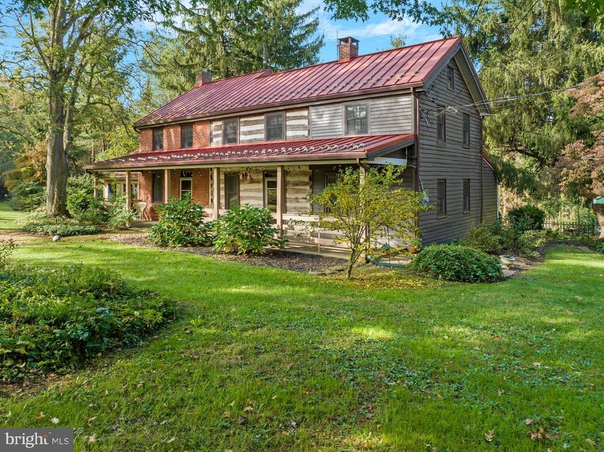 Beautifully updated with the original charm preserved, this 1800-1900s farmhouse has been lovingly maintained and perfectly decorated by its current owners.  Once you pass through the corn crib, you’ll find your own personal retreat on almost 3.5 acres at the end of a private lane in Stewartstown.  Brick walkways lead you through manicured landscaping to the house, featuring 4 beds, 2 baths, and amazing living spaces.  The foyer opens  to a four seasons room - a perfect space for relaxing with vaulted ceilings and views of the outdoor space - and a study with beautiful built-ins and an original fireplace.   A spacious living room with a second fireplace and exposed log and brick walls await in the next room, followed by a formal dining room.  The attached kitchen with a breakfast nook is updated with a new farm sink and leads to a large double deck.  The first floor bedroom is an adorable space - perfect as a guest room, an office, or even a private room with its own entrance off the deck.  The charming updates continue on the second floor with a truly spa-like bathroom, double staircases, a dreamy master bedroom, and two more bedrooms.  New paint throughout is complemented by the original hardwood floors and exposed beams.  The outdoor space is perfect for entertaining or relaxing- the open space is complemented by plenty of surrounding trees and mature landscaping, and the barn offers tons of storage space.  Covered storage/parking, a workshop, and a finished space (used by the current owner as a small shop) complete your private oasis.  The perfect mix of old and new, properties like this are few and far in between!