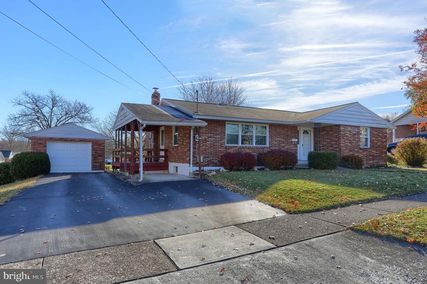Large brick ranch home with beautiful hardwood floors throughout. Home is very deceiving from the front.  Home has 4 beds/2 full baths and nice size addition on back that has a large bedroom and family room.  Basement is partially finished with another family room area.  Screened in porch which looks out over almost 1/2-acre yard.  One car detached garage.   Home is close to 283, 322, and Hershey Med  Center.