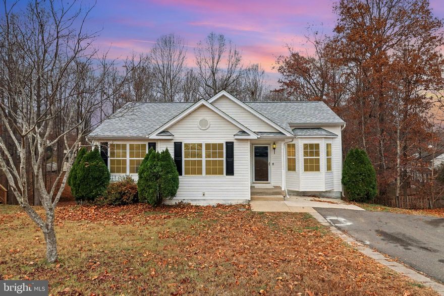 Welcome to this charming rambler located in the desirable Hickory Ridge community! This beautifully updated 4-bedroom, 3-bath home offers the perfect blend of comfort and functionality with nearly 2,000 finished square feet. Featuring two primary bedrooms, this home provides exceptional flexibility for multigenerational living or guest accommodations.
Step inside to find all-new interior paint, new carpet, and hardwood floors that enhance the bright, welcoming atmosphere. The open living room features a vaulted ceiling and a bay window that fills the space with natural light. The spacious eat-in kitchen boasts new luxury vinyl plank flooring, ample cabinetry, and direct access to the freshly stained rear deck, ideal for outdoor dining or entertaining.
The main-level primary suite includes a generous walk-in closet and a relaxing ensuite bath with a soaking tub and separate shower. Two additional bedrooms and an updated full bath with new LVP flooring complete the main level. Downstairs, you’ll find a mostly finished walk-out basement offering a large recreation room and a second primary bedroom with a private full bath—perfect for guests or an in-law suite—along with a dedicated laundry/storage area.
Additional updates include a new roof and fresh deck staining. Outside, enjoy the privacy of a fully fenced backyard with mature trees and a spacious deck overlooking the 0.37-acre lot.
Conveniently located near commuter lots, the VRE, schools, and shopping—this home offers easy access to everything Stafford and Fredericksburg have to offer.