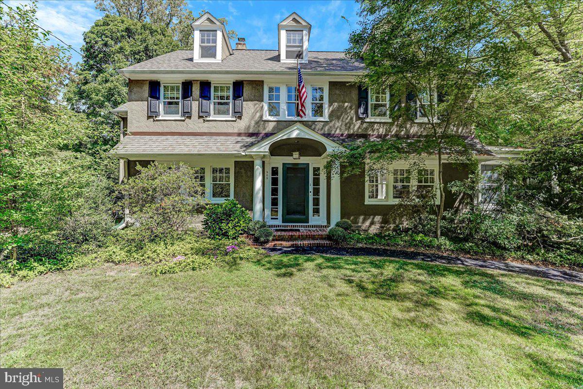 Welcome to this charming home in North Wayne, where every detail has been thoughtfully designed for comfort and style. Step into the inviting fireside living room, featuring built-in book cases and French doors that open to a sunlit sunroom—an ideal space for a home office or a cozy reading nook. The dining room provides a warm setting for intimate dinners, while the spacious kitchen, complete with a gathering space and breakfast area is perfect for both casual meals and entertaining. As you head upstairs the primary bedroom offers generous closet space and a well-appointed bath with double sinks and a private shower area. You'll find three additional bedrooms with large closets and hall bath. The third floor is a versatile flex space, adaptable for living, working, or additional sleeping arrangements, and includes a storage room that could be converted into an additional bath if desired. The large, flat yard is a great canvas for outdoor gatherings and enjoyment, and the home is nestled in a charming cul-de-sac that embodies the essence of Wayne. With its prime location within walking distance to the heart of Wayne, you'll enjoy convenient access to transportation, dining, and shopping. This home truly offers a blend of elegance, functionality, and community charm—ready to welcome its new owner.