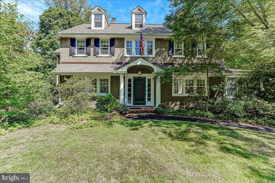 Welcome to this charming home in North Wayne, where every detail has been thoughtfully designed for comfort and style. Step into the inviting fireside living room, featuring built-in book cases and French doors that open to a sunlit sunroom—an ideal space for a home office or a cozy reading nook. The dining room provides a warm setting for intimate dinners, while the spacious kitchen, complete with a gathering space and breakfast area  is perfect for both casual meals and entertaining.  As you head upstairs the primary bedroom offers generous closet space and a well-appointed bath with double sinks and a private shower area. You'll find three additional bedrooms with large closets and hall bath. The third floor is a versatile flex space, adaptable for living, working, or additional sleeping arrangements, and includes a storage room that could be converted into an additional bath if desired. The large, flat yard is a great canvas for outdoor gatherings and enjoyment, and the home is nestled in a charming cul-de-sac that embodies the essence of Wayne. With its prime location within walking distance to the heart of Wayne, you'll enjoy convenient access to transportation, dining, and shopping. This home truly offers a blend of elegance, functionality, and community charm—ready to welcome its new owner.