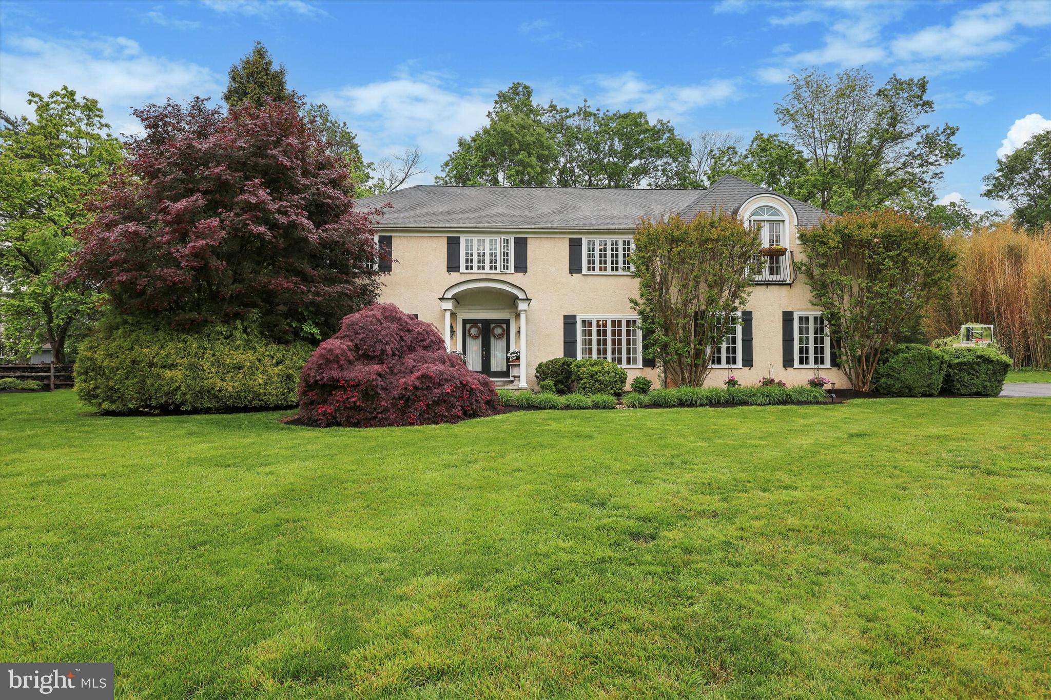 Location matters! Welcome to this wonderful Lower Gwynedd residence, offering over 4,100 square feet of thoughtfully designed living space. Tucked away on a private cul de sac, this home is set back on a serene 1.08-acre property with mature trees and vibrant plantings, combining privacy with sophistication. A generously sized foyer welcomes you inside and introduces you to a formal dining room on your right, and to the left, you will discover an impressive formal living room with beautiful glass French doors, a fireplace and custom-built in bookshelves. Both areas provide excellent space for entertaining, whether it be formally or otherwise. The heart of the home boasts an open concept kitchen with granite countertops, skylights, and a sunny breakfast nook with a window bench, flowing into a large den/game room with a cathedral ceiling that opens right out to the patio for indoor-outdoor fun. Don't forget the quaint spiral staircase that will lead you directly to the primary suite. Relax in the inviting family room with a beautiful brick gas fireplace, and take advantage of a separate office/flex space perfect for a playroom, study area, or work from home setup. Conveniently off the garage entrance, you will find a separate laundry area and extra storage helps keep things organized. A powder room completes the main level. Heading to the second floor, step into an elegant primary suite featuring tray ceilings that add architectural depth and sophistication. The spacious layout includes a dedicated vanity area, a spa-like soaking tub, and a generously sized walk-in closet for ample storage. French door windows flood the room with natural light, creating a serene and airy ambiance— your private retreat awaits. A wide hallway connects the additional three bedrooms and two full baths. The finished basement offers additional living space, perfect for a second family room, home office, gym or guest accommodations, expanding your home's versatility. From the rear, enjoy the breathtaking views of the surrounding nature from two separate patios, which offer a favorite spot for grilling and dining al fresco, not to mention, hard-wired generator set up and ready to go! Ideally located just steps from Lower Gwynedd’s scenic trails and only a short distance from one of three SEPTA train stations to Center City, this home offers unbeatable convenience. It’s part of the award-winning Wissahickon School District, with both the high school and middle school accessible by a nearby trail. Enjoy proximity to terrific restaurants, shopping, and all your daily essentials. Don’t miss the opportunity to make this exceptional property your forever home. Schedule your showing today! Showings start Sunday at the open house, 11-1. Stop by!