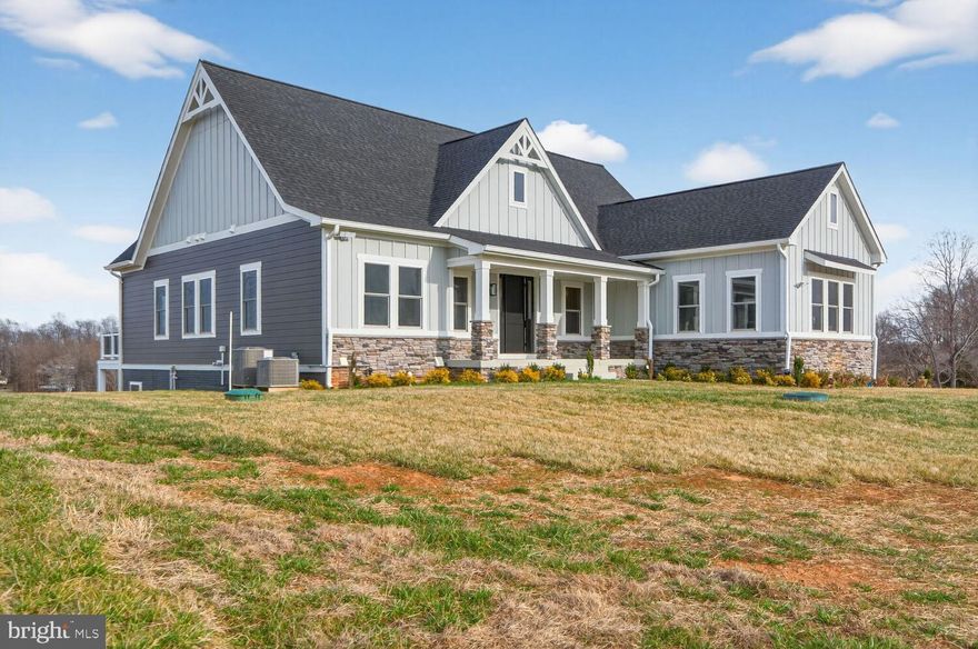 Move-In Ready | Brand-New Construction Water-View Home in Rock Island Landing

Stunning newly constructed luxury custom home located in the prestigious Rock Island Landing community on the private side of Lake Anna. This exceptional water-view property offers approximately 4,412 sq. ft. of thoughtfully designed living space with 10-foot ceilings on the main level and 9-foot ceilings in the fully finished walkout basement.

The home features 6 bedrooms, 4 full bathrooms, and 2 powder rooms, plus a second full kitchen, making it ideal for multi-generational living or entertaining. Included is one deeded covered boat slip with electric boat lift (#1).

The main level showcases an expansive great room with tray ceilings, fireplace, and sliding glass doors leading to a sundeck and screened porch with beautiful lake views. The gourmet kitchen is equipped with a large island, farmhouse sink, quartz countertops, shaker-style cabinetry, stainless steel appliances, and a pantry.

The luxurious primary suite offers serene lake views, a spacious walk-in closet, and a spa-inspired bathroom with dual vanities and a tiled shower.

The finished walkout lower level includes three additional bedrooms, two full bathrooms, a powder room, a full kitchen, dining area, second fireplace (media room optional, and direct access to a concrete patio pre-wired for a hot tub.

Additional highlights include a covered front porch, rear decks, and excellent outdoor living spaces. Paved driveway and sidewalk. Conveniently located near The Boardwalk at Lake Anna with easy access to Richmond, Charlottesville, Fredericksburg, and Washington, D.C.

Short-term rentals are allowed, offering strong investment potential or an ideal private getaway. With modern design, upscale finishes, water access, breathtaking lake views, and a premier location, this home delivers the best of Lake Anna living.

Other water-view and waterfront lots available. Don’t miss out!