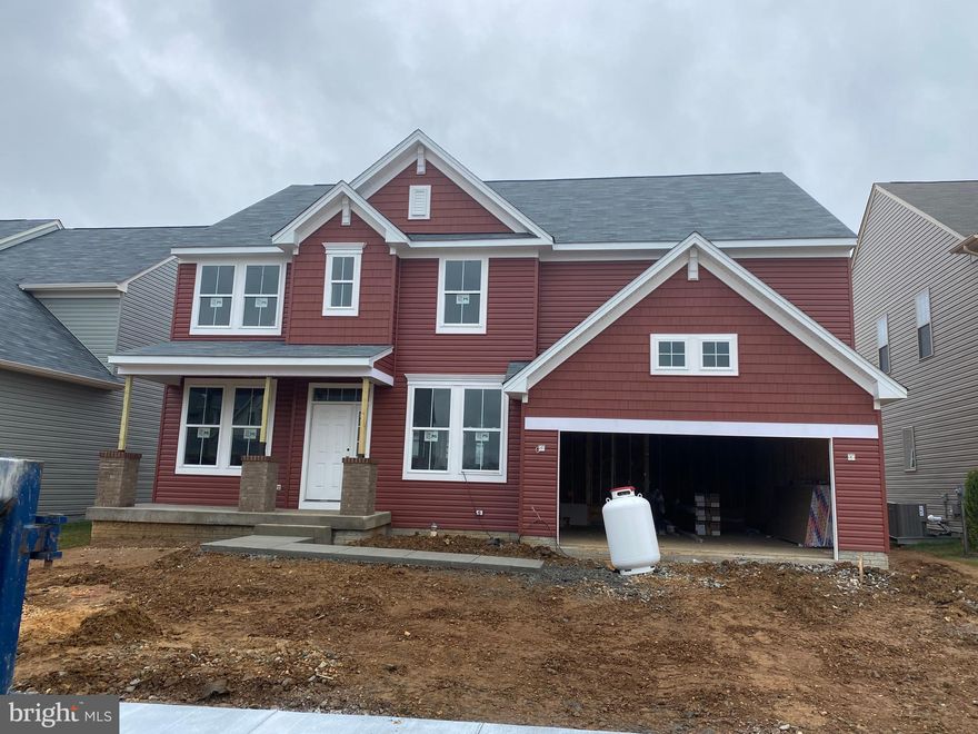 Beautiful new construction single family home in coveted location of New Post, just 2 minutes to VRE and less than 10 minutes to downtown Fredericksburg.  Craftsman style exterior with brick columns along full front porch, walking into a wide open foyer, you will find a dining room and study.  Making your way into the home, you'll see a massive two story family room with two sets of windows letting in an amazing amount of daylight.  The breakfast area and kitchen are right next to this massive space, perfect for entertaining and family interaction!  Upstairs is 4 bedrooms, including a large master bedroom with attached luxury bath with two separate sinks, an opening for a vanity, big corner soaking tub, standing shower with seat and a dual entry walk-in closet.  Oversized laundry on upper floor.  BUT WAIT, THERE'S MORE!  Huge fin. rec room in the basement & finished full bath.  2 car front entry garage with additional tandem garage space inside.