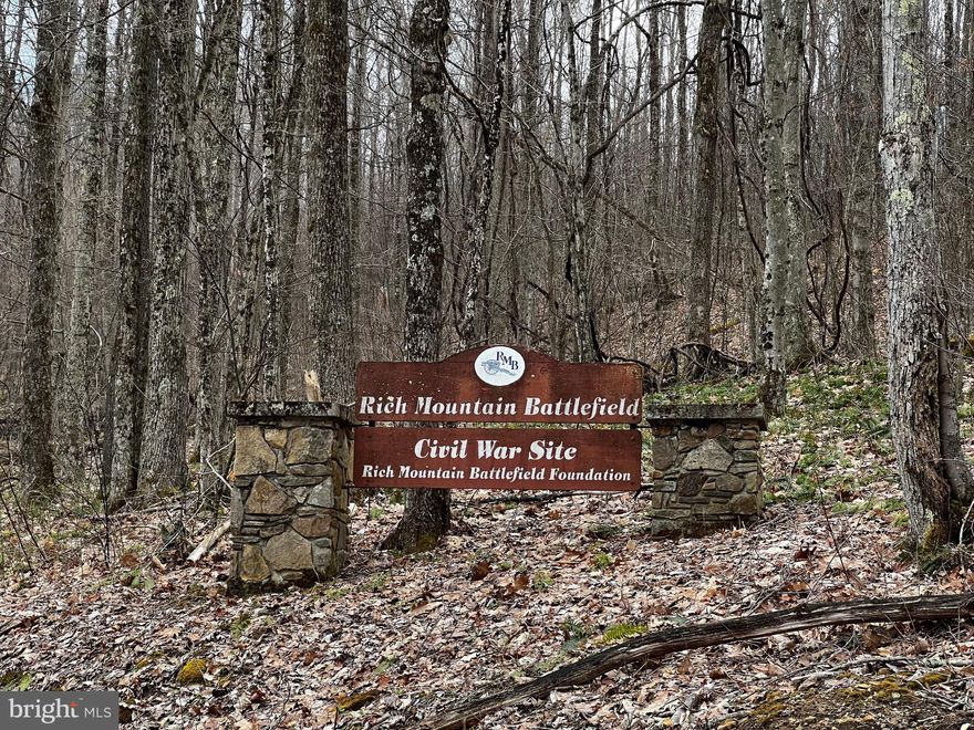 Secluded lots at the top of ridge on historic Rich Mountain with public water and electric already in place!! Lots 4 and 5 sold together equating to a little over four acres.. Public water and electric available  and a pad pushed out for a cabin or permanent residence! If you like seclusion, sound of a roaring creek, yet amenities of water and electric easily available, this place has it! Backing up to Rich Mountain Battlefield, Interstate Hardwoods,  PH Timber, etc.. you can roam the PUBLIC trails to your hearts content! Entrance to property is directly across from Field of Fire, which has beautiful Laurel Run, fields, picnic area and shelters. 
Must see this area to appreciate the historic significance of the Battle of Rich Mountain on July 11, 1861 and you'll want to build your dream home here!