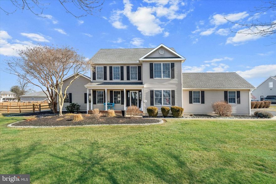 Welcome to Fox Hunter Crossing, one of Middletown’s most desirable communities, where space, style, and comfort come together on a rare three-quarter-acre corner lot.   This beautiful home, built by Stover, features a charming covered front porch, a fully fenced yard, a paved rear patio perfect for outdoor entertaining, and a turned garage that enhances both curb appeal and functionality.  Step inside to gleaming hardwood floors throughout the main level, complemented by porcelain tile in the kitchen and powder room.  The kitchen is thoughtfully designed with granite countertops, real wood painted cabinetry, a large sink, stainless steel appliances, and a bright breakfast nook—ideal for everyday living and casual dining.  The highlight of the main level is a stunning, Step-down, great room addition giving you an additional 700 sq. ft, offering exceptional space for relaxing, entertaining, or gathering with family and friends (also built by Stover).  Upstairs, the generous primary suite features a fully upgraded en-suite bath with a walk-in tiled shower and double bowl vanity, with a vaulted ceiling and large walk-in-closet.  Three additional well-sized bedrooms and an updated hall bath complete the second floor.   Engineered hardwood flooring runs throughout the entire upper level and stairway, accented by elegant wrought iron spindles.   The finished basement provides versatile space perfect for a game room, playroom, or media area, with the laundry conveniently located on the lower level.  With its spacious lot, quality upgrades, and exceptional living spaces, this stylish home offers the perfect blend of elegance and everyday comfort in a prime Middletown location.   Great location for easy commuting.