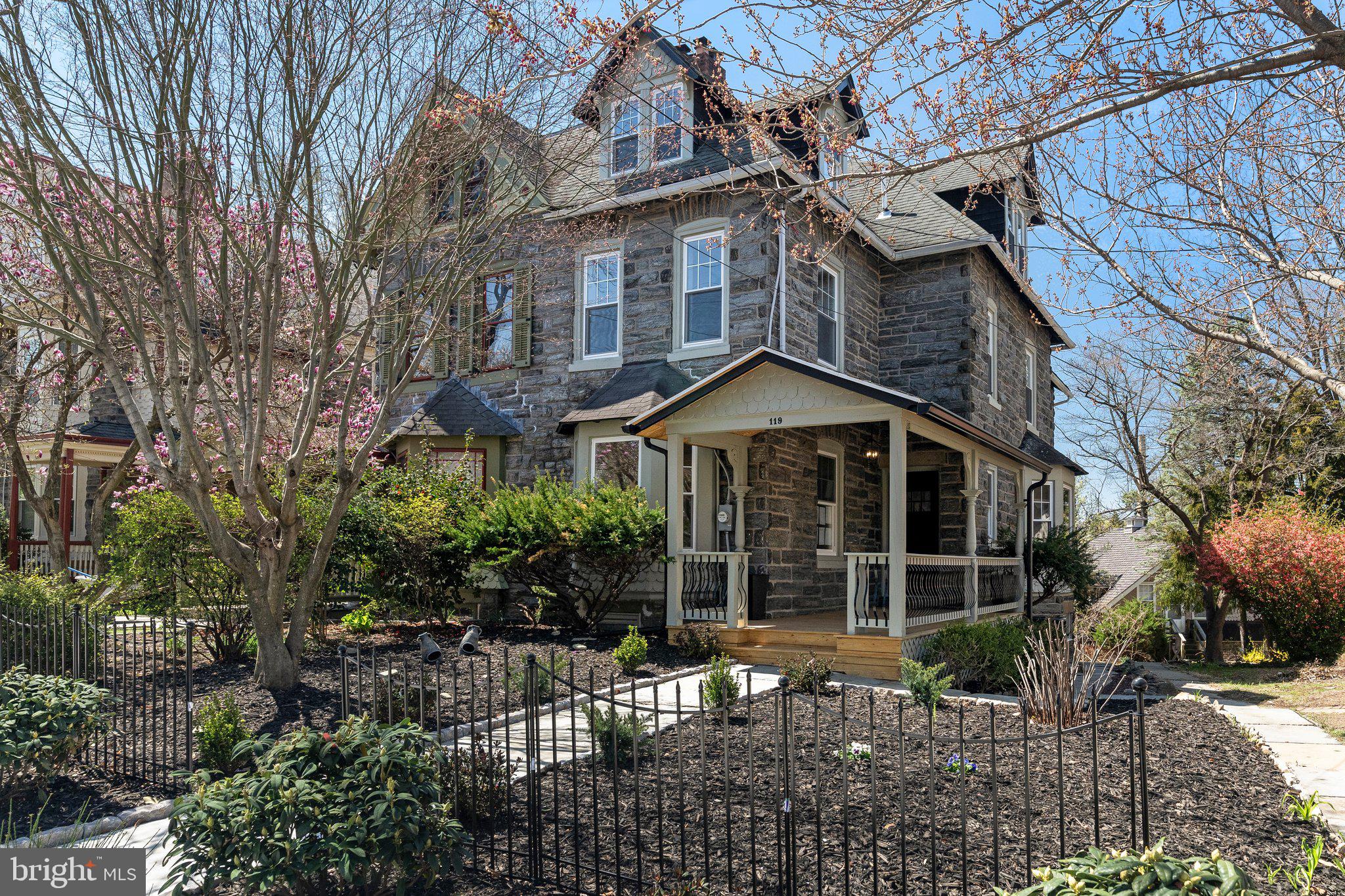 Picture perfect curb appeal welcomes you to this Unique stone facade residence providing a timeless and elegant look in the heart of historic and vibrant Chestnut Hill, offering amazing character and is move-in ready! The 119 Bethlehem Pike is a Dream Home you’ve always wanted, surrounded by a verdant, manicured landscape and situated in Philadelphia’s most desirable neighborhood. The home presents a truly distinctive living experience offering an enchanting blend of modern living and classic charm. This 4 bedrooms and 3.5 bathrooms home has been masterfully reimagined with top finishes and artfully curated with an inviting layout. Step inside and discover an ambiance of refined elegance, where every detail has been thoughtfully considered. Hardwood flooring, all new windows, recessed lighting and much more throughout the entire residence. Upon entering through the gorgeous front porch and then into the home you will be greeted by a spacious foyer. Continuing onto an open floor plan that seamlessly integrates the living spaces, creating an inviting and spacious atmosphere. Formal spacious living room with gorgeous fireplace and lots of natural light. The heart of the home is the beautifully created Gourmet & Upscale kitchen designed with YOU in mind. It’s a culinary haven featuring an abundance of windows, counter space and custom cabinetry including top-of-the-line appliances with six burner range/oven, hood exhaust, counter depth refrigerator, microwave drawer, wine cooler, dishwasher, pot filler, hot water dispenser, country sink with food disposal, integrated inside cabinet lighting, premium countertops, backsplashes and a huge center island. All that next to the exterior door leading to an oversized balcony overlooking this property's crowning jewels of backyard oasis with freshly manicured landscaping designed for ultimate relaxation and entertainment. First floor powder room for convenience. Ascend those beautifully reimagined wide staircase and stepping to the second floor sleeping level you will find a luxurious Master suite. This sanctuary boasts a huge bedroom with lots of natural light, roomy walk-in closet and an exquisite en-suite bath showcasing high-end fixtures, exquisite tiling, abundance of natural light, walk-in shower with a spa-like ambiance that promises relaxation. Continue the hallway on the same level to find another bedroom with ceiling fan and generous-size closet and a full Hall Bath with wide vanity and mirror, elegant lighting, full tub, toilet and a window. You will also find a fully equipped LAUNDRY with stackable washer and dryer. Ascend once more onto a third floor sleeping level to find 2 generous sized bedrooms, different by layout, but identical in their charm. Both rooms are graced with plenty of closet space and windows with natural light. In addition you will find an OFFICE SPACE and a full hall bath, offering step-in shower, refined tiling, a toilet, vanity with mirror and a window. The lower level offers a full walkout to a rear DRIVEWAY basement as a great addition for a second home-office, entertainment or a playroom. There is also an unfinished part which is great for storage. Located in historic Chestnut Hill just a short walk from the neighborhood's charming shops, restaurants & cafes on Germantown Ave as well as Chestnut Hill East regional train line station. This is an exceptional opportunity to own such an elegant piece that exudes elegance and boasts a multitude of stunning upgrades of one of Philadelphia's most desirable neighborhoods. Come make it yours today and embrace this epitome of mix of modern/classic living….it won’t last long!