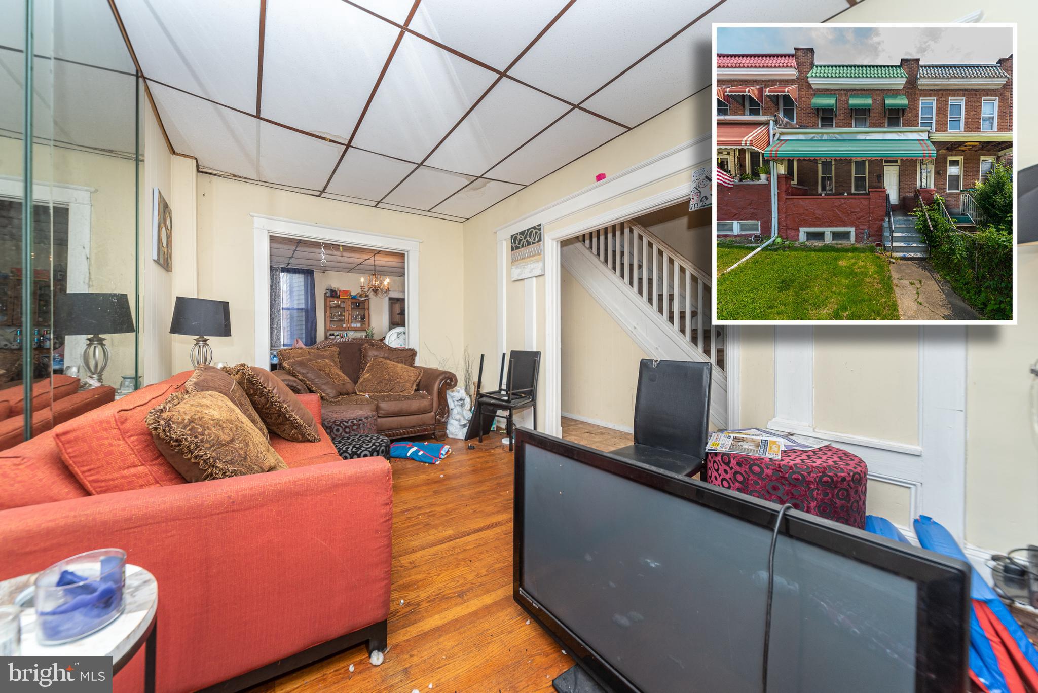 TURN KEY PORCH FRONT ROWHOME CURRENTLY RENTED FOR $1,000/MO. Main level with a spacious living room, separate dining room, and kitchen. Upper level with 3 bedrooms and 1 full bath. Full unfinished basement that's perfect for storage and a rear fenced yard. Sold As-Is!