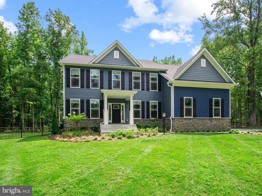 A modern dream home in a storybook setting! Surrounded by stables, marinas, and gorgeous green space, this West River beauty is situated on an enchanting 1.5-acre lot.  Completed in 2021 by Anne Arundel County's premier builder Ameri-Star, you will fall in love with its charm and elegance from the moment you 
pull up - mature trees, and an oversized portico welcome you inside. With a newly added wide staircase leading down to a completely fenced-in rear yard, this Craftsman-style home is now better than new. Luxurious amenities and fine details are found throughout the home, including high ceilings, exquisite millwork, oversized cased windows, and engineered hardwood flooring. The dramatic 2-story family room, complete with a propane fireplace with granite surround, is light-filled and beautiful.  It's open to the incredible chef's kitchen where granite counters, upgraded white cabinetry, and stainless steel appliances meld together flawlessly to create and enjoy the peace and tranquility of an inviting space to cook and entertain. A huge center island with breakfast bar seating is the centerpiece of the room, and a sliding glass door leads out to the yard for easy grilling or dining al fresco. This level also includes formal living & dining rooms, and an Office/5th Bedroom and a powder room. An oak switchback staircase leads to the upper level, 
where an expansive primary suite offers the perfect place to unwind. Two-piece crown molding 
and floor-to-ceiling windows accent the space, and 2 walk-in closets and a luxe attached bath add to the elegance. The upper level also offers 3 additional bedrooms, all spacious & bright, a full hall bath, and a convenient laundry closet. The walkout, unfinished lower level is a chance to bring your vision and make it your own (rough in for full bathroom is already in place). A side load 2 car garage & whole house generator complete this gorgeous home. Revel in country life while still enjoying the benefits of nearby shopping, restaurants, entertainment, & more. The 
location is within close proximity to Annapolis, DC, Northern VA and surrounding areas!