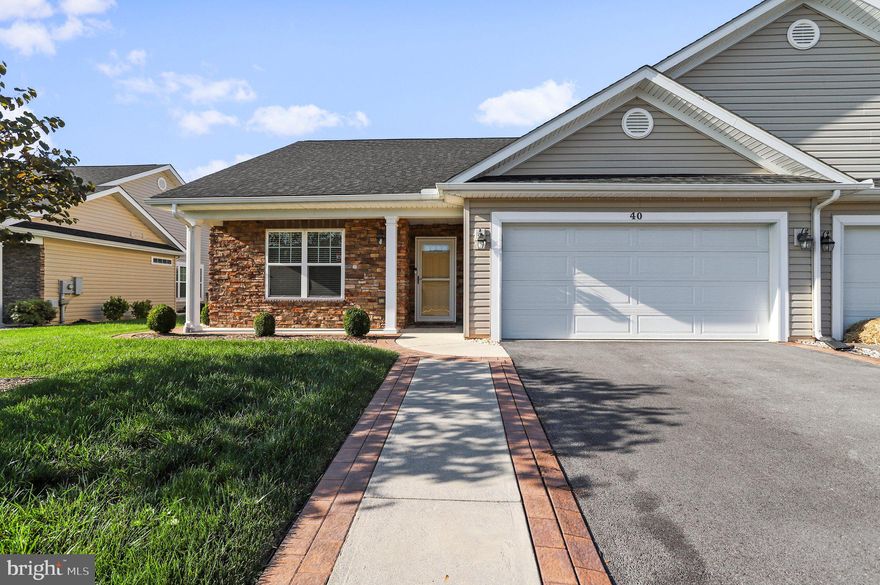 Welcome home to this charming villa style home in the sought after Spring Mills Community! This home features two bedrooms and two full bathrooms, gleaming hardwood floors, cozy gas fireplace, large laundry/mud room, beautiful stainless steel appliances with an over the range hood and microwave built into the kitchen island, and a large two car garage. Bask in the openness and airy feel with tons of natural light. Enjoy the perks and convenience of main level living and walk out to the gorgeous and private screened in porch with ceiling fans in the oasis of a backyard with its mature and pristine landscaping. If that's not enough, the home has close proximity to restaurants, schools, and major commuter routes! Schedule your private tour today before it's too late!