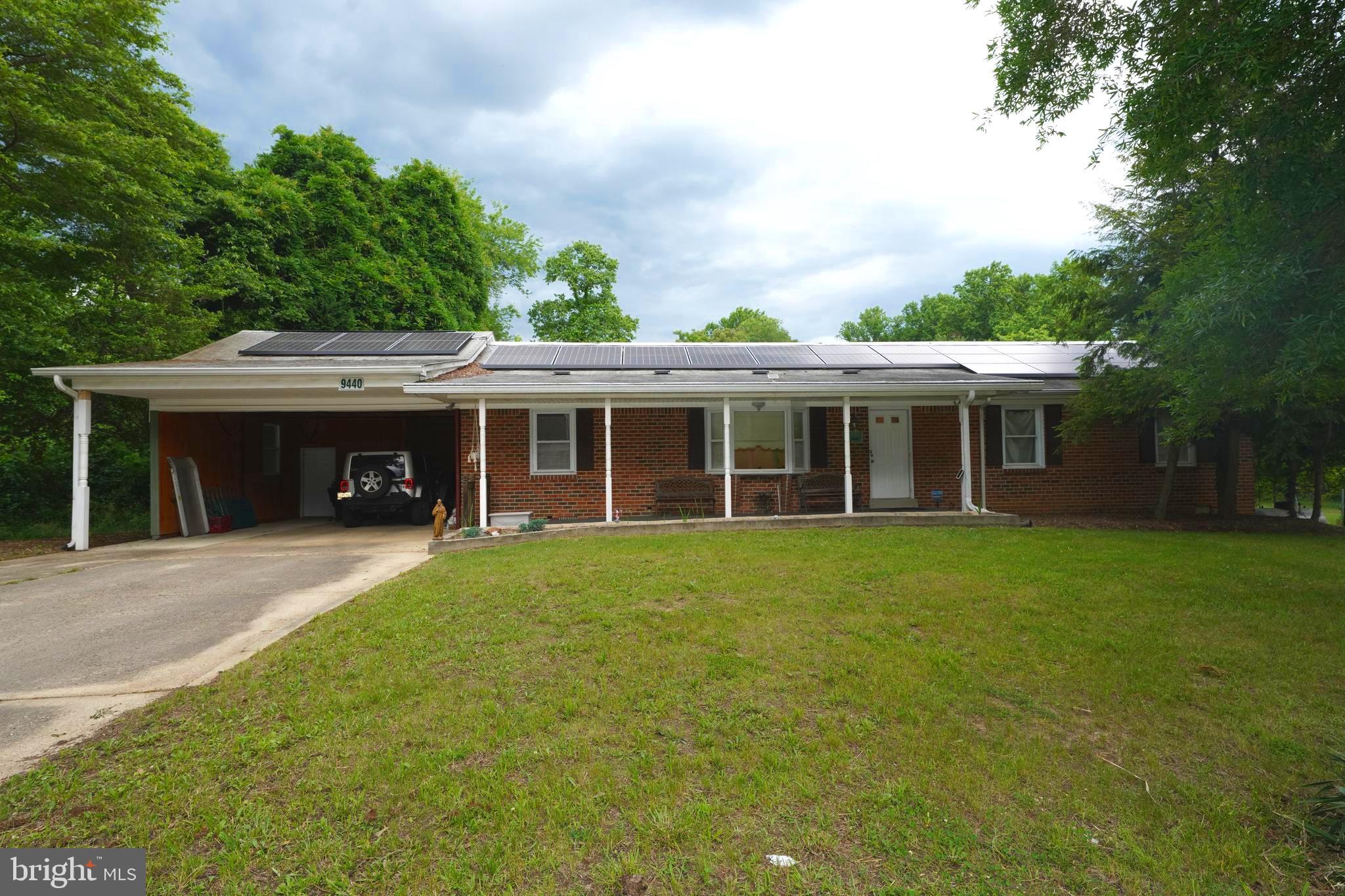*Seller Offering $10,000 Towards Closing Cost or Paying Down Solar Panel Balance*One-Level Living Convenient to Key Amenities* Ideally located, this beautiful 3 bed 2.5 bath brick rancher welcomes you home. Imagine reading a book or entertaining friends and family while relaxing on the breezy front porch. Cross over the threshold into a light-filled living room which seamlessly transitions to the spacious gourmet kitchen. The lovely primary bedroom has an ensuite bathroom. The other two bedrooms are ready for your decorative touch. Your outdoor furniture transforms the inviting patio into an extension of the home, where you can unwind and appreciate nature. Beautiful mature trees and a serene pond with water lilies complete the backyard oasis. The storage sheds are included to store all the essentials. Enjoy the convenience and energy efficiency of installed Tesla solar panels. A concrete driveway with ample accommodation for two vehicles leads to an attached two-car carport. Quiet setting, No HOA, yet just minutes to US-301, stores, shopping, and parks. 4 min to Southern Area Aquatics and Rec Complex, which offers classes, swimming, and a gym. 5 Min to Brandywine Elementary School, 18 min to Joint Base Andrews. This is the home you have been waiting for. Schedule a private tour before it’s gone!