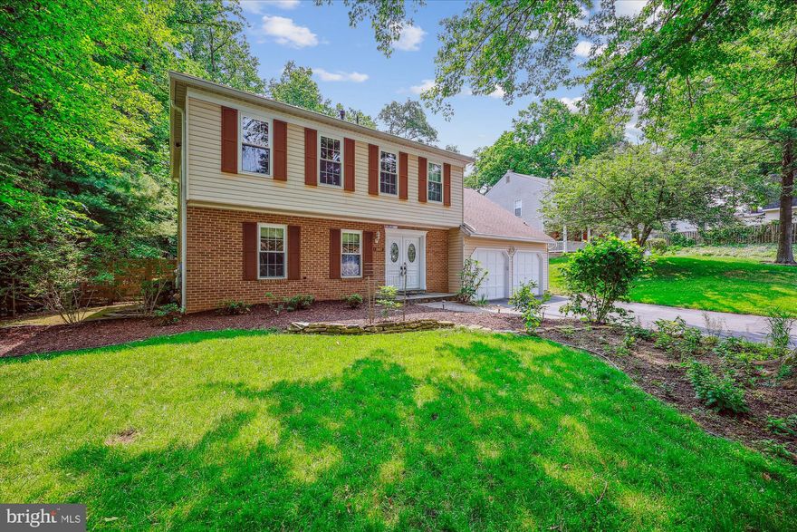 Tucked away in a quiet wood like setting, this impeccably maintained colonial will not disappoint! Ideal for modern living, the colonial is timeless and there is so much more home than meets the eye. The double front doors open into a spacious ceramic laid foyer. Hardwood floors sweep through the large living room and connect back into the dining space highlighted by its bay window facing the backyard. The kitchen is perfect for any cook and entertaining with a central island, loads of countertop and prep space, and ample storage in the solid curly maple wood cabinets. Just off the kitchen is a convenient breakfast space with views to the backyard and that further connects to the family room, which is centered around the large wood-burning fireplace. A true bonus for this model colonial is the three season vaulted ceiling sunroom with skylights and access to the backyard patio. The first floor is rounded out by a powder room and access to the two car garage. Upstairs, you’ll find four spacious bedrooms with great size closet and two full baths. The hall bath has undergone a more recent renovation with ceramic tile and modern finishes. The master suite is an elevated retreat with hardwood floors, walk-in closet. The bathroom offers heated floors, two vanities and a glass door walk-in shower. The unfinished basement offers ample upside opportunity to add to the total finish square footage as well as a rough-in for a third full bathroom. The home has a brand new AC system, full fenced yard, and native plantings all around creating that sense of excitement as you arrive to your new home!