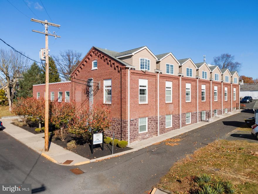 Renovated Brick Factory Loft with Industrial Charm & Modern Comforts. Step into this stunning 2-floor loft, with 1,214 sq ft of living space, transformed from a historic brick factory into a spacious and stylish modern home. This unique residence blends industrial character with contemporary design, featuring 3 bedrooms, 2 full baths, and a private 2-car garage. Enter from the main floor into an expansive open-concept living space with soaring ceilings, recessed lighting, engineered hardwood with cork backing throughout, and large factory-style windows. There's a chef’s kitchen with stainless steel appliances, granite countertops, and custom cabinetry, including an island with seating area. The main floor primary bedroom has great natural daylight, a walk-in closet and a primary bath that is shared with the hallway. Down the industrial style sprial staircase are two same sized bedrooms with large windows and ample storage. There is a full bathroom and a Laundry/Utiltiy room that leads to the 2-car Garage. This rare loft offers the perfect blend of industrial elegance, historic charm, and modern convenience. Located in a quiet neighborhood, with a short drive to shops, dining, and transportation. Don’t miss the chance to own this one-of-a-kind urban retreat!